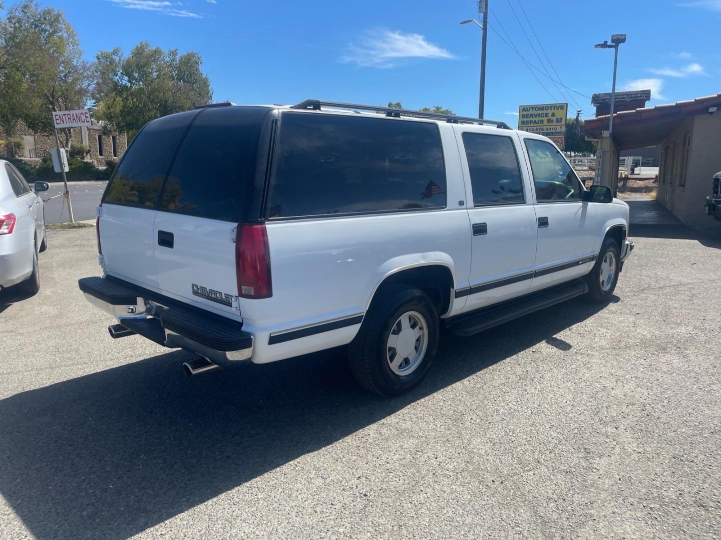 1999 White Chevrolet Suburban LT (1GNEC16R5XJ) with an 8 Cylinder Other engine, 5-Speed Automatic transmission, located at 800 Riverside Ave, Roseville, CA, 95678, 916-773-4549 & Toll Free: 866-719-4393, 38.732265, -121.291039 - LT 8 PASSENGER NEW TIRES LOW MILES CLEAN CARFAX- Photo#3