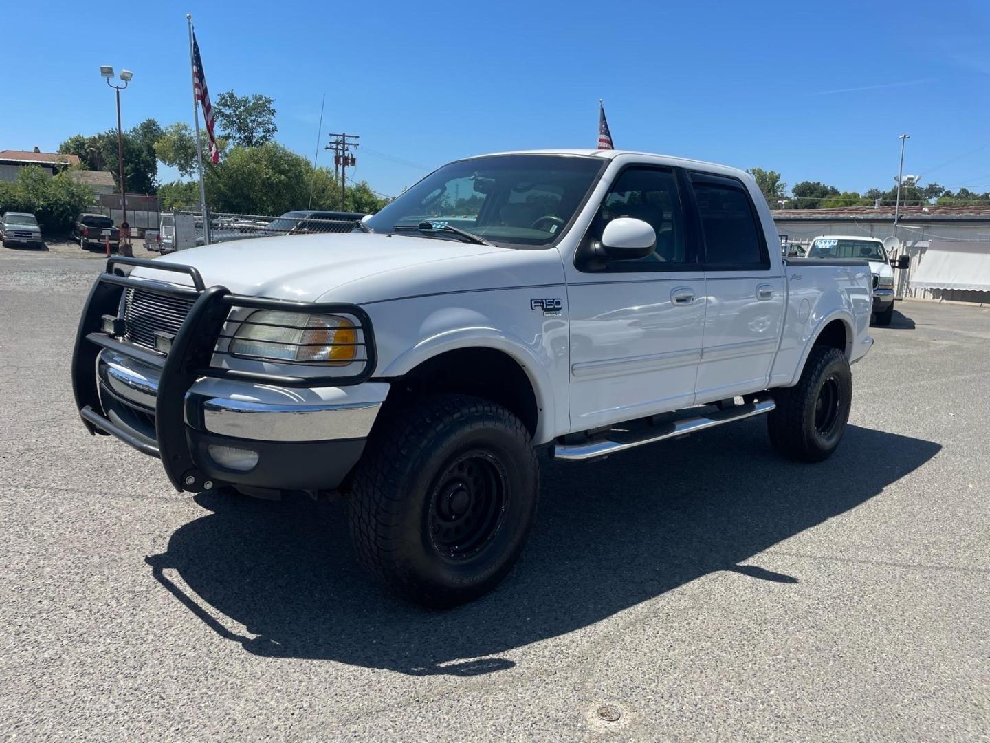 2003 Oxford White Ford F-150 Lariat (1FTRW08L83K) with an Triton 5.4L V8 260hp 350ft. lbs. Other engine, 4-Speed Automatic transmission, located at 800 Riverside Ave, Roseville, CA, 95678, 916-773-4549 & Toll Free: 866-719-4393, 38.732265, -121.291039 - 4X4 SUPERCREW LARIAT LOW MILES MOON ROOF- Photo#0