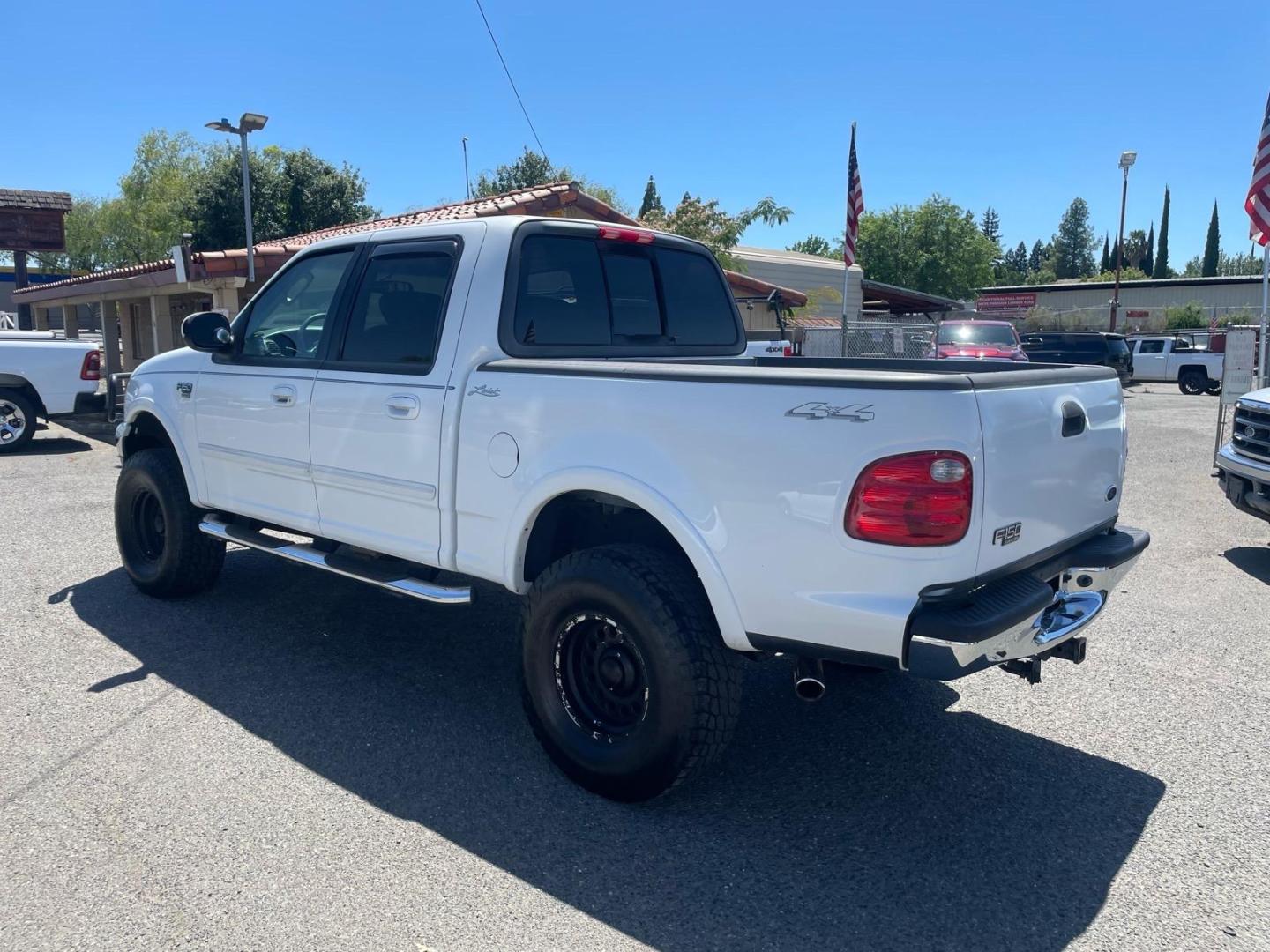 2003 Oxford White Ford F-150 Lariat (1FTRW08L83K) with an Triton 5.4L V8 260hp 350ft. lbs. Other engine, 4-Speed Automatic transmission, located at 800 Riverside Ave, Roseville, CA, 95678, 916-773-4549 & Toll Free: 866-719-4393, 38.732265, -121.291039 - 4X4 SUPERCREW LARIAT LOW MILES MOON ROOF- Photo#3