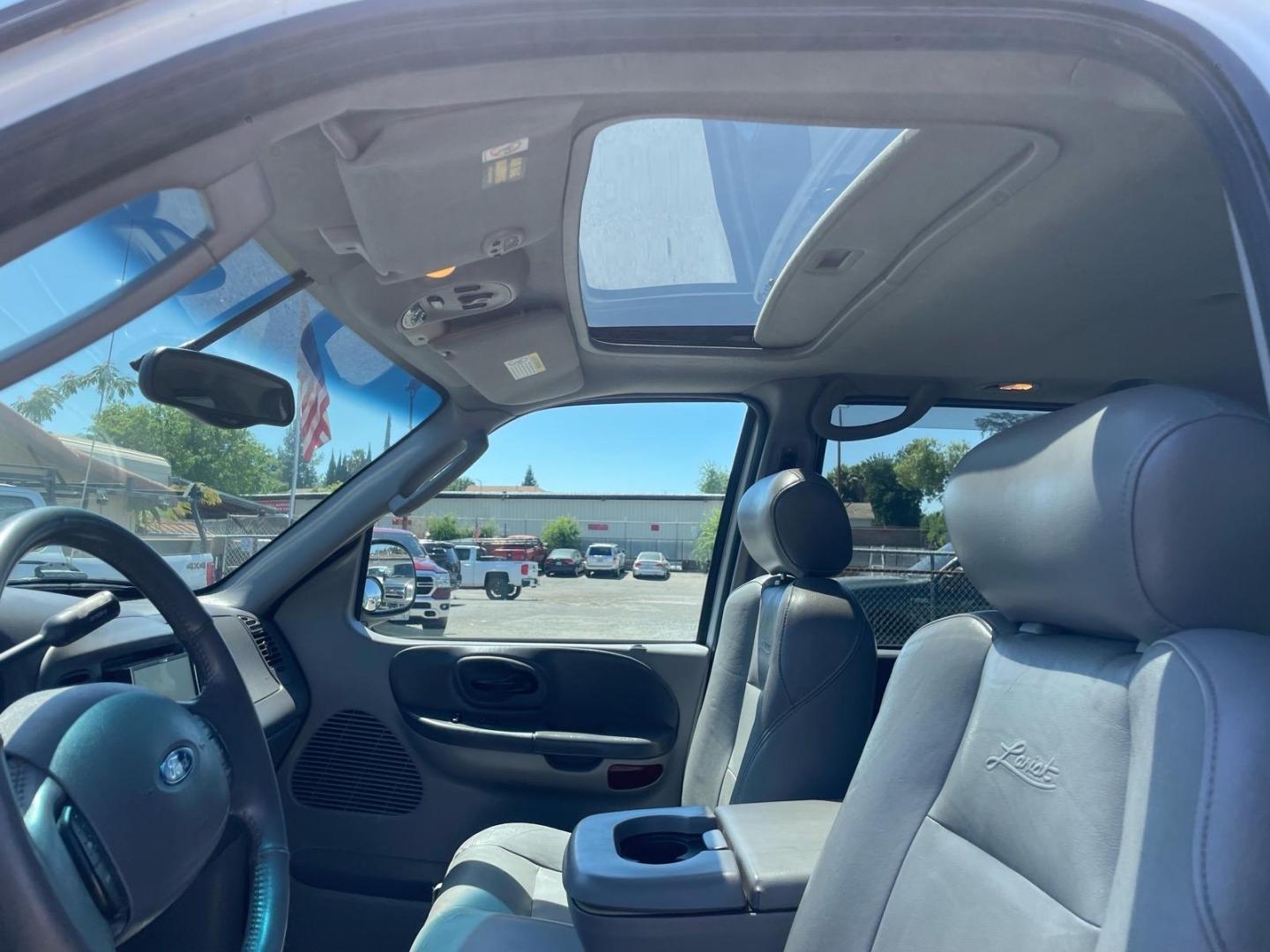 2003 Oxford White Ford F-150 Lariat (1FTRW08L83K) with an Triton 5.4L V8 260hp 350ft. lbs. Other engine, 4-Speed Automatic transmission, located at 800 Riverside Ave, Roseville, CA, 95678, 916-773-4549 & Toll Free: 866-719-4393, 38.732265, -121.291039 - 4X4 SUPERCREW LARIAT LOW MILES MOON ROOF- Photo#9