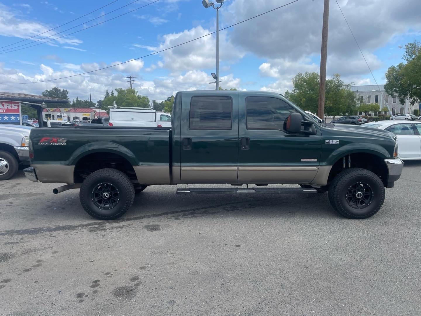 2003 Dark Highland Green Metallic/Arizona Beige Metalli Ford F-250 Super Duty Lariat (1FTNW21P03E) with an Power Stroke 6.0L Diesel Turbo V8 325hp 560ft. lbs. Other engine, 5-Speed Automatic transmission, located at 800 Riverside Ave, Roseville, CA, 95678, 916-773-4549 & Toll Free: 866-719-4393, 38.732265, -121.291039 - DIESEL CREW CAB 4X4 FX4 LARIAT LIFTED CLEAN CARFAX- Photo#5