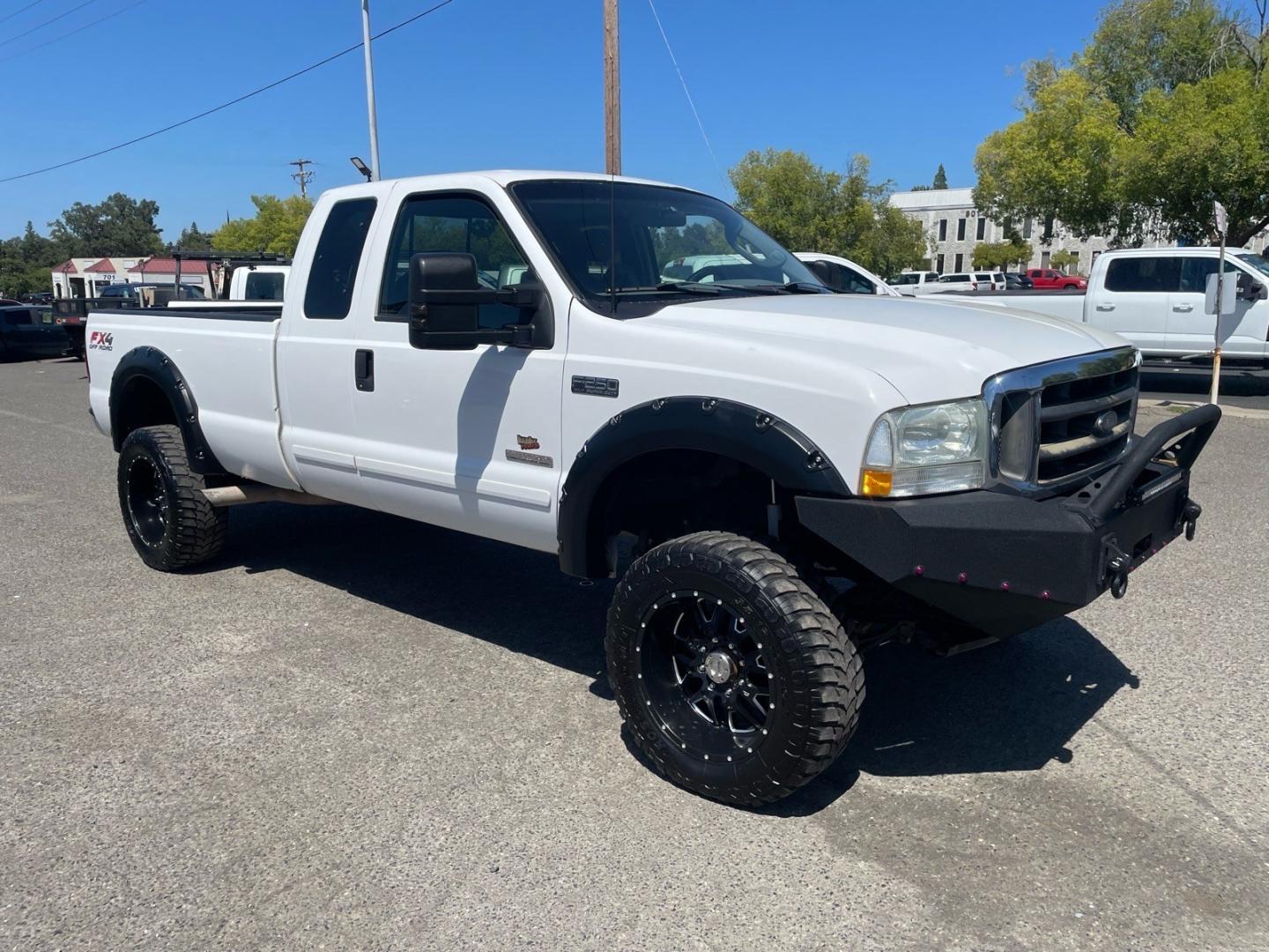 2003 Oxford White Ford F-250 Super Duty XLT (1FTNX21P03E) with an Power Stroke 6.0L Diesel Turbo V8 325hp 560ft. lbs. Other engine, 5-Speed Automatic transmission, located at 800 Riverside Ave, Roseville, CA, 95678, 916-773-4549 & Toll Free: 866-719-4393, 38.732265, -121.291039 - DIESEL SUPER CAB 4X4 LIFTED- Photo#1