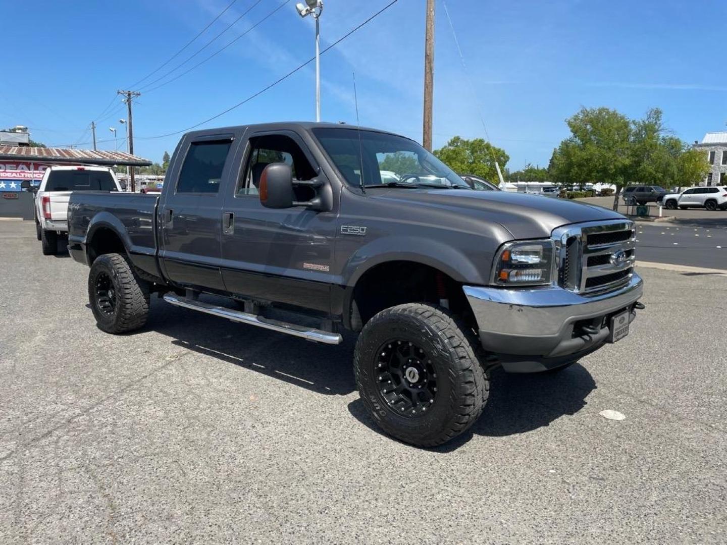 2003 Dark Shadow Grey Metallic/Black Ford F-250 Super Duty Lariat (1FTNW21P53E) with an Power Stroke 6.0L Diesel Turbo V8 325hp 560ft. lbs. Other engine, 5-Speed Automatic transmission, located at 800 Riverside Ave, Roseville, CA, 95678, 916-773-4549 & Toll Free: 866-719-4393, 38.732265, -121.291039 - DIESEL CREW CAB 4X4 LARIAT LIFTED CLEAN CARFAX - Photo#1