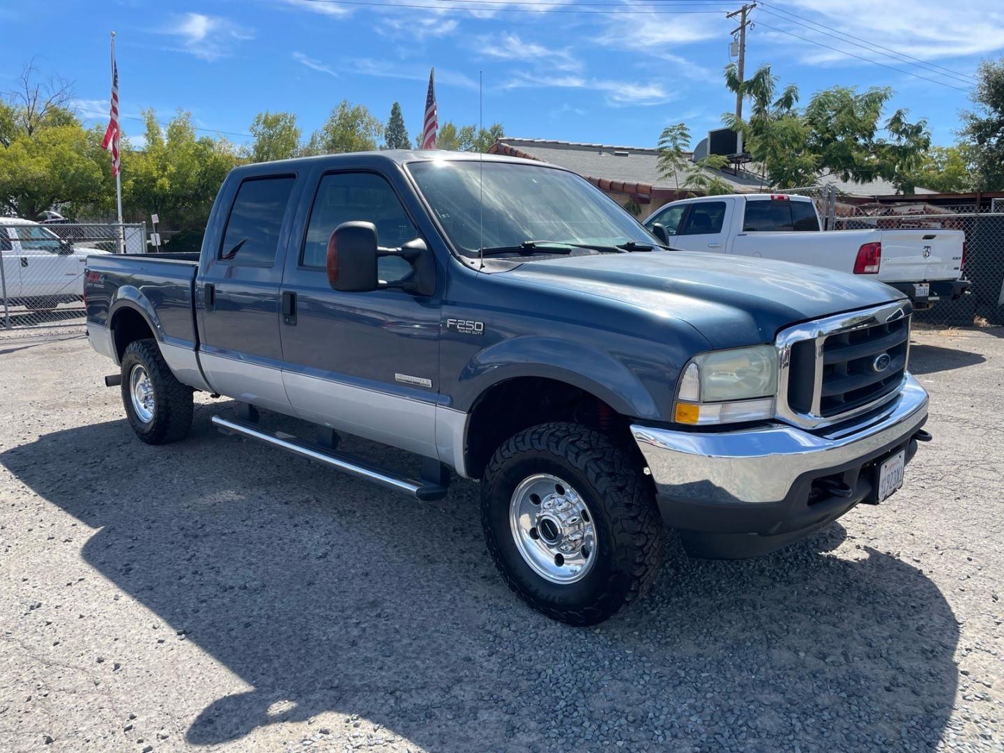 2004 Medium Wedgewood Blue Clearcoat Ford F-250 Super Duty XLT (1FTNW21P44E) with an Power Stroke 6.0L Diesel Turbo V8 325hp 560ft. lbs. Other engine, 5-Speed Automatic transmission, located at 800 Riverside Ave, Roseville, CA, 95678, 916-773-4549 & Toll Free: 866-719-4393, 38.732265, -121.291039 - DIESEL CREW CAB 4X4 FX4 XLT CLEAN CARFAX- Photo#1