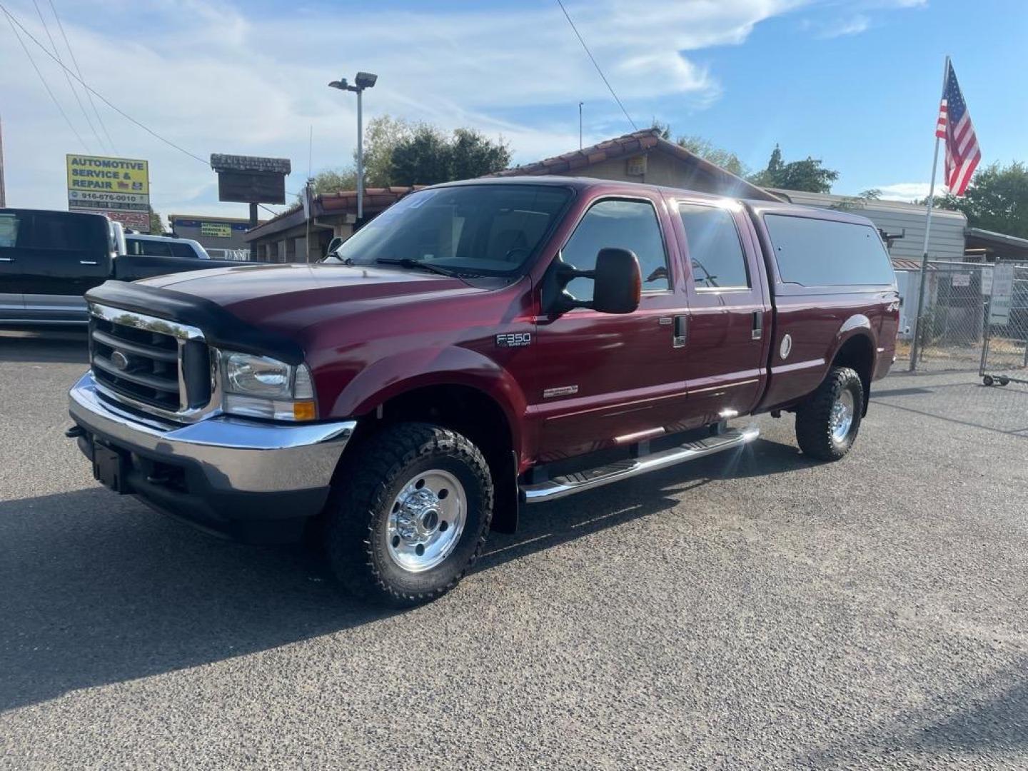 2004 Dark Toreador Red Clearcoat Ford F-350 Super Duty XLT (1FTSW31P44E) with an Power Stroke 6.0L Diesel Turbo V8 325hp 560ft. lbs. Other engine, 5-Speed Automatic transmission, located at 800 Riverside Ave, Roseville, CA, 95678, 916-773-4549 & Toll Free: 866-719-4393, 38.732265, -121.291039 - DIESEL CREW CAB 4X4 XLT LOW MILES ONE OWNER - Photo#0