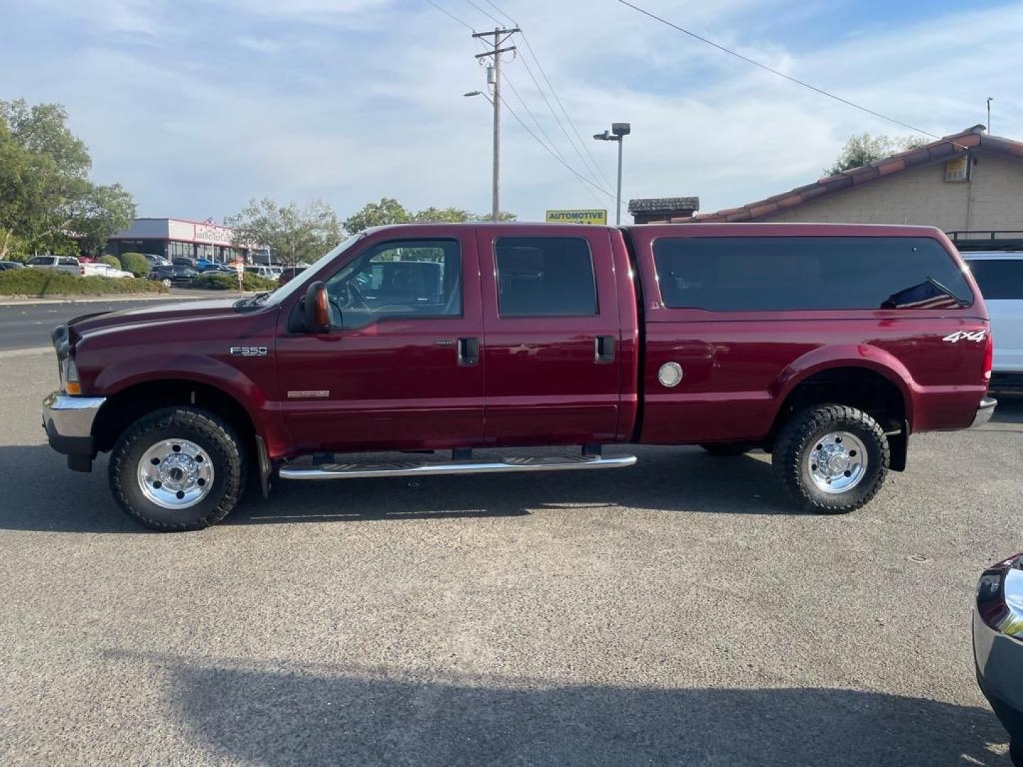 2004 Dark Toreador Red Clearcoat Ford F-350 Super Duty XLT (1FTSW31P44E) with an Power Stroke 6.0L Diesel Turbo V8 325hp 560ft. lbs. Other engine, 5-Speed Automatic transmission, located at 800 Riverside Ave, Roseville, CA, 95678, 916-773-4549 & Toll Free: 866-719-4393, 38.732265, -121.291039 - DIESEL CREW CAB 4X4 XLT LOW MILES ONE OWNER - Photo#5