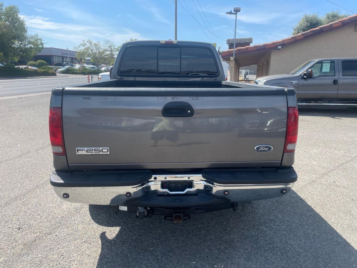 2005 Dark Shadow Grey Clearcoat Metallic Ford F-250 Super Duty Lariat (1FTSW21P45E) with an 6.0L Power Stroke 6.0L Diesel Turbo V8 325hp 560ft. lbs. Direct Injection engine, 5-Speed Automatic transmission, located at 800 Riverside Ave, Roseville, CA, 95678, 916-773-4549 & Toll Free: 866-719-4393, 38.732265, -121.291039 - DIESEL CREW CAB 4X4 FX4 LARIAT HEADSTUDS SERVICE RECORDS- Photo#7