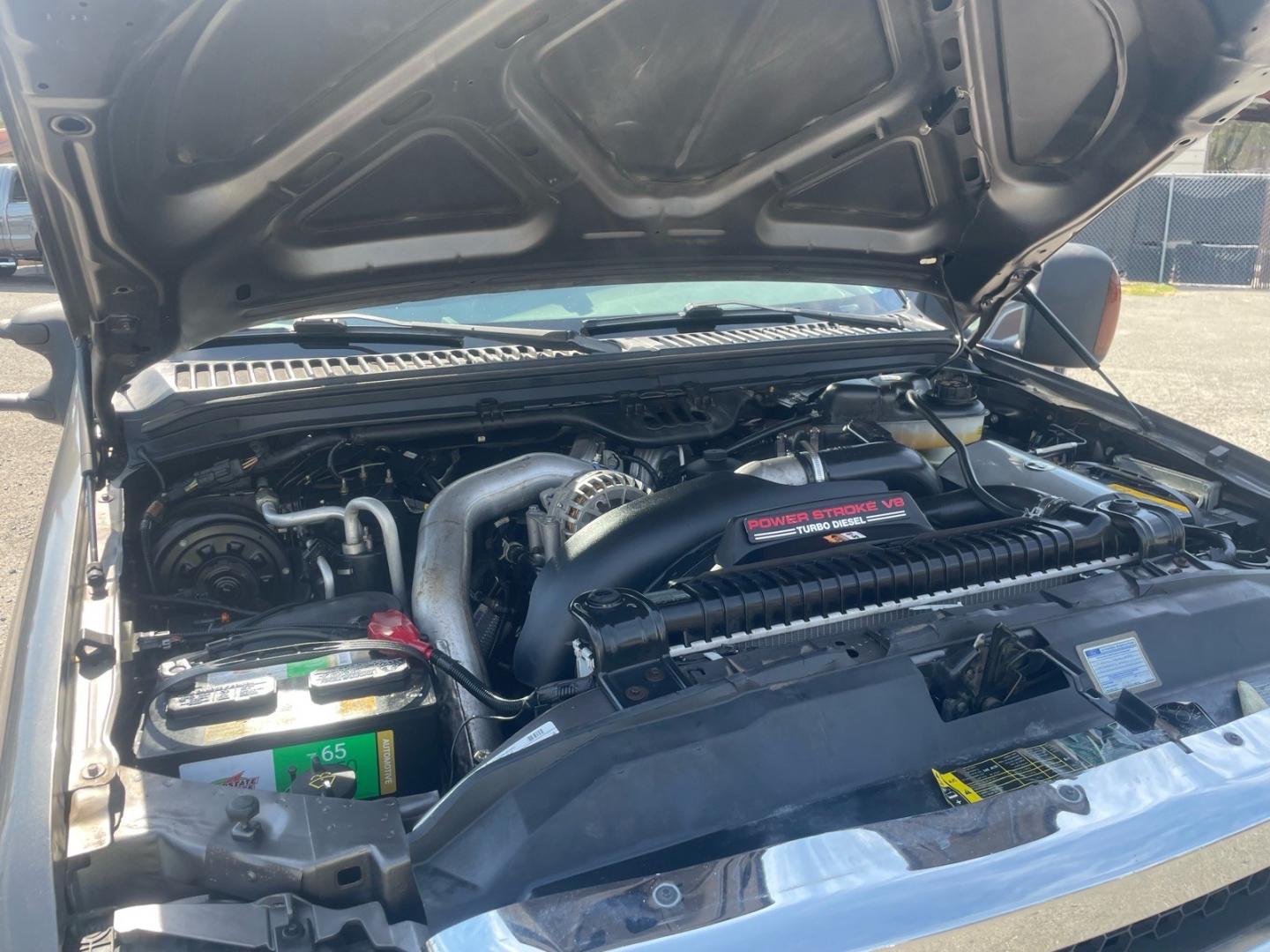2005 Dark Shadow Grey Clearcoat Metallic Ford F-250 Super Duty Lariat (1FTSW21P45E) with an 6.0L Power Stroke 6.0L Diesel Turbo V8 325hp 560ft. lbs. Direct Injection engine, 5-Speed Automatic transmission, located at 800 Riverside Ave, Roseville, CA, 95678, 916-773-4549 & Toll Free: 866-719-4393, 38.732265, -121.291039 - DIESEL CREW CAB 4X4 FX4 LARIAT HEADSTUDS SERVICE RECORDS- Photo#14