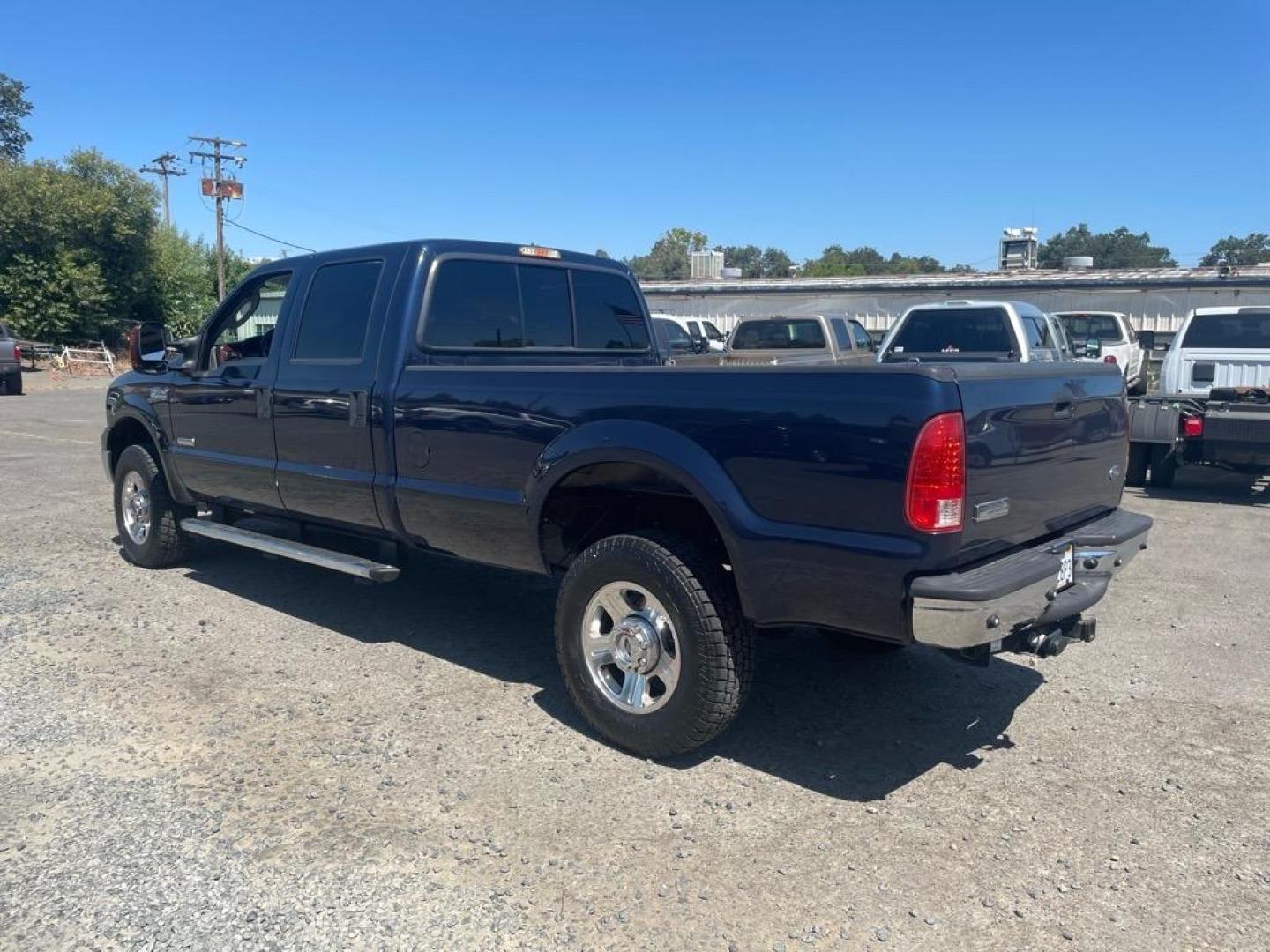 2005 True Blue Clearcoat Metallic Ford F-350 Super Duty Lariat (1FTWW31P25E) with an 6.0L Power Stroke 6.0L Diesel Turbo V8 325hp 560ft. lbs. Direct Injection engine, 5-Speed Automatic transmission, located at 800 Riverside Ave, Roseville, CA, 95678, 916-773-4549 & Toll Free: 866-719-4393, 38.732265, -121.291039 - DIESEL CREW CAB 4X4 LARIAT LOW MILES BULLET PROOF EGR AND OIL COOLER MOON ROOF CLEAN CARFAX - Photo#2