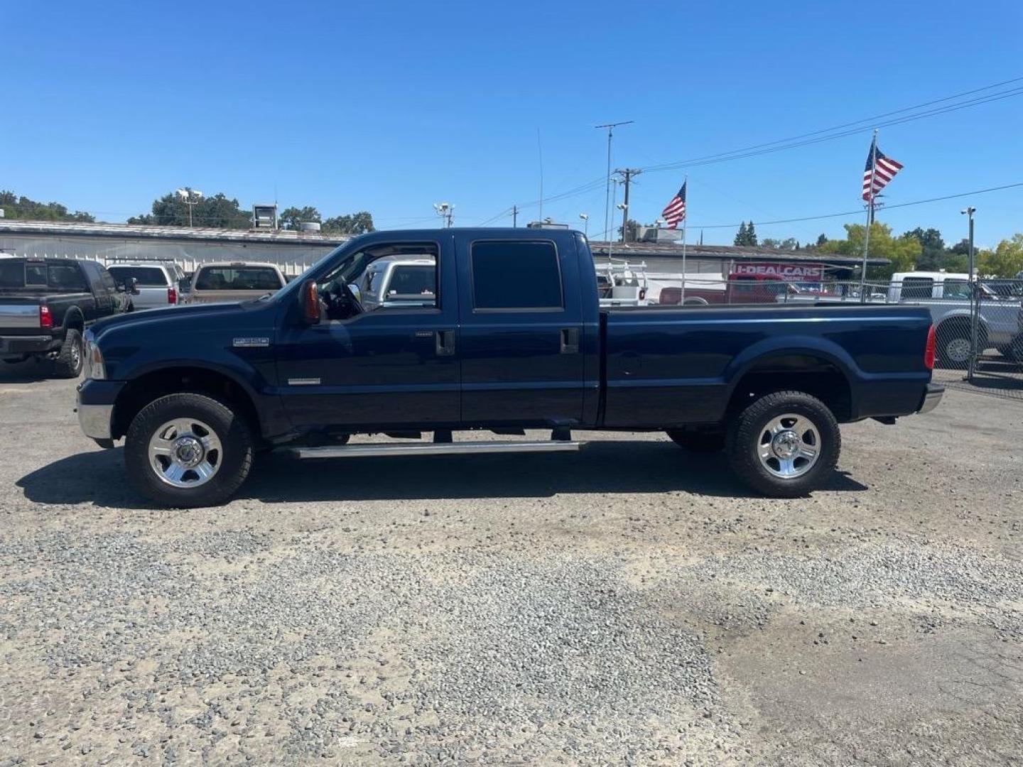 2005 True Blue Clearcoat Metallic Ford F-350 Super Duty Lariat (1FTWW31P25E) with an 6.0L Power Stroke 6.0L Diesel Turbo V8 325hp 560ft. lbs. Direct Injection engine, 5-Speed Automatic transmission, located at 800 Riverside Ave, Roseville, CA, 95678, 916-773-4549 & Toll Free: 866-719-4393, 38.732265, -121.291039 - DIESEL CREW CAB 4X4 LARIAT LOW MILES BULLET PROOF EGR AND OIL COOLER MOON ROOF CLEAN CARFAX - Photo#4