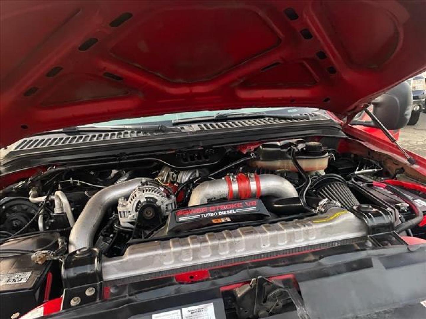 2005 Red Clearcoat Ford F-250 Super Duty Lariat (1FTSW21P05E) with an 6.0L Power Stroke 6.0L Diesel Turbo V8 325hp 560ft. lbs. Direct Injection engine, 5-Speed Automatic transmission, located at 800 Riverside Ave, Roseville, CA, 95678, 916-773-4549 & Toll Free: 866-719-4393, 38.732265, -121.291039 - DIESEL CREW CAB 4X4 BULLET PROOF EGR COOLER HEADSTUDS NEW TIRES LIFTED - Photo#15