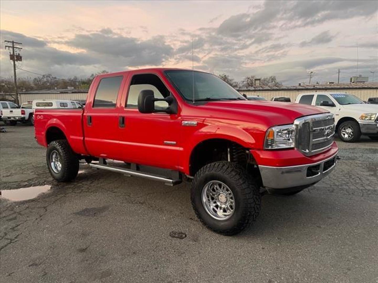 2005 Red Clearcoat Ford F-250 Super Duty Lariat (1FTSW21P05E) with an 6.0L Power Stroke 6.0L Diesel Turbo V8 325hp 560ft. lbs. Direct Injection engine, 5-Speed Automatic transmission, located at 800 Riverside Ave, Roseville, CA, 95678, 916-773-4549 & Toll Free: 866-719-4393, 38.732265, -121.291039 - DIESEL CREW CAB 4X4 BULLET PROOF EGR COOLER HEADSTUDS NEW TIRES LIFTED - Photo#1