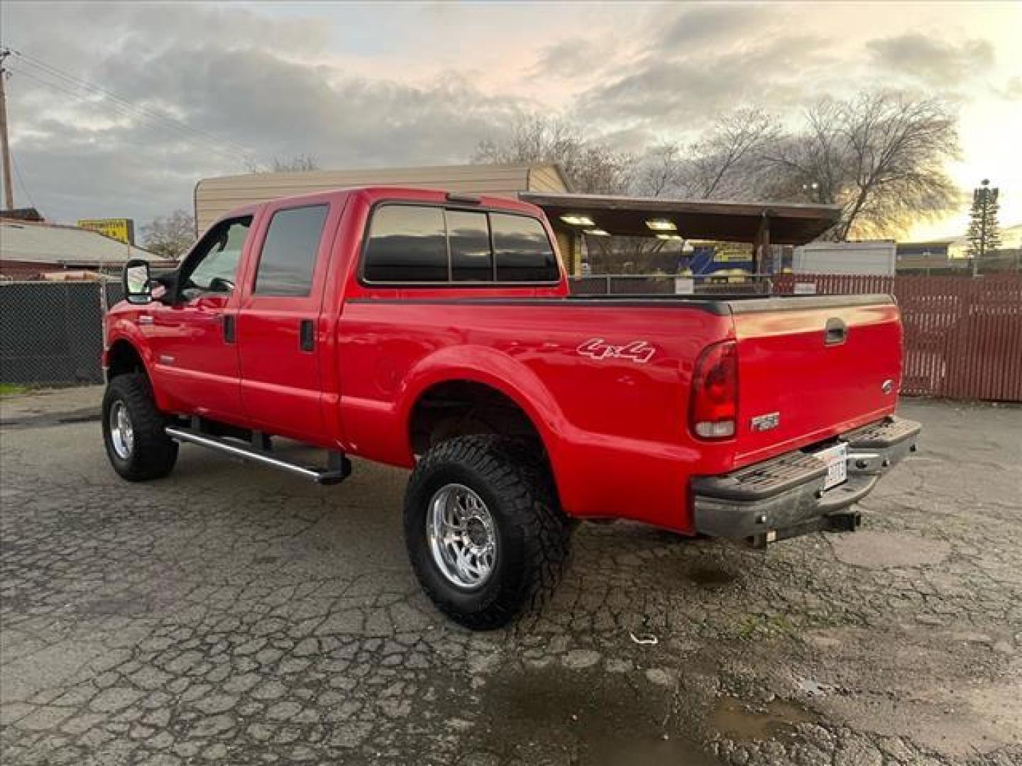 2005 Red Clearcoat Ford F-250 Super Duty Lariat (1FTSW21P05E) with an 6.0L Power Stroke 6.0L Diesel Turbo V8 325hp 560ft. lbs. Direct Injection engine, 5-Speed Automatic transmission, located at 800 Riverside Ave, Roseville, CA, 95678, 916-773-4549 & Toll Free: 866-719-4393, 38.732265, -121.291039 - DIESEL CREW CAB 4X4 BULLET PROOF EGR COOLER HEADSTUDS NEW TIRES LIFTED - Photo#2