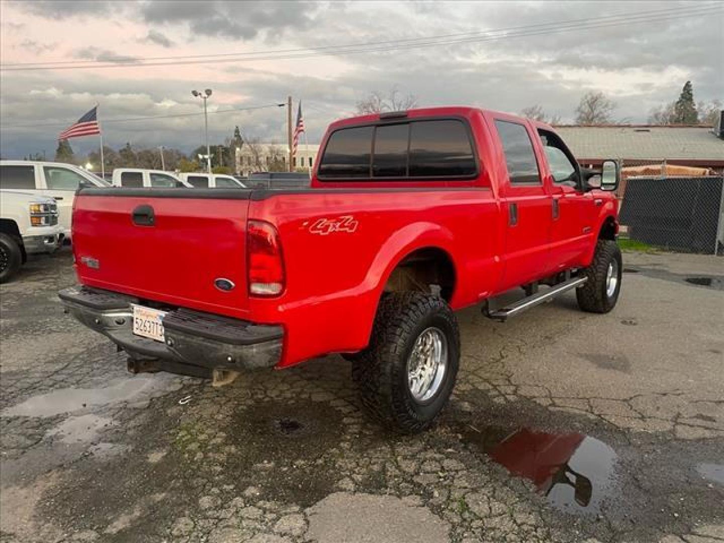 2005 Red Clearcoat Ford F-250 Super Duty Lariat (1FTSW21P05E) with an 6.0L Power Stroke 6.0L Diesel Turbo V8 325hp 560ft. lbs. Direct Injection engine, 5-Speed Automatic transmission, located at 800 Riverside Ave, Roseville, CA, 95678, 916-773-4549 & Toll Free: 866-719-4393, 38.732265, -121.291039 - DIESEL CREW CAB 4X4 BULLET PROOF EGR COOLER HEADSTUDS NEW TIRES LIFTED - Photo#3