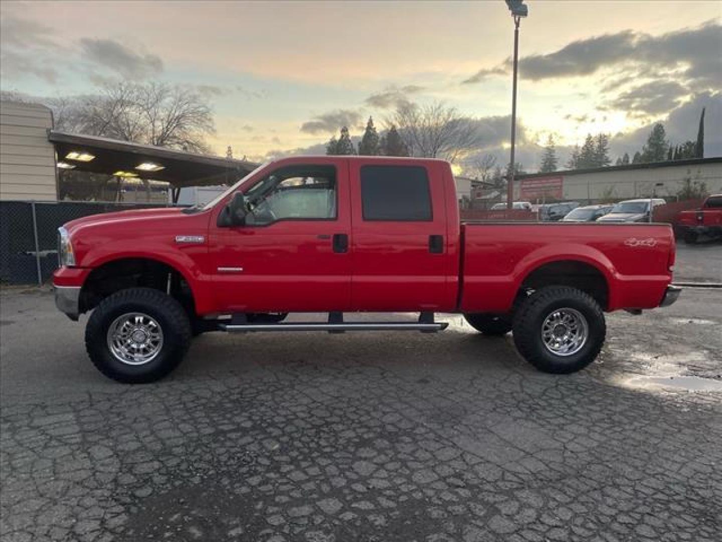 2005 Red Clearcoat Ford F-250 Super Duty Lariat (1FTSW21P05E) with an 6.0L Power Stroke 6.0L Diesel Turbo V8 325hp 560ft. lbs. Direct Injection engine, 5-Speed Automatic transmission, located at 800 Riverside Ave, Roseville, CA, 95678, 916-773-4549 & Toll Free: 866-719-4393, 38.732265, -121.291039 - DIESEL CREW CAB 4X4 BULLET PROOF EGR COOLER HEADSTUDS NEW TIRES LIFTED - Photo#4
