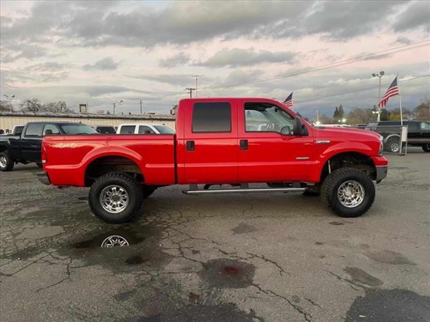 2005 Red Clearcoat Ford F-250 Super Duty Lariat (1FTSW21P05E) with an 6.0L Power Stroke 6.0L Diesel Turbo V8 325hp 560ft. lbs. Direct Injection engine, 5-Speed Automatic transmission, located at 800 Riverside Ave, Roseville, CA, 95678, 916-773-4549 & Toll Free: 866-719-4393, 38.732265, -121.291039 - DIESEL CREW CAB 4X4 BULLET PROOF EGR COOLER HEADSTUDS NEW TIRES LIFTED - Photo#5