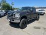 2006 Brown Ford F-250 Super Duty Lariat (1FTSW21P16E) with an 6.0L Power Stroke 6.0L Diesel Turbo V8 325hp 560ft. lbs. Direct Injection engine, 5-Speed Automatic transmission, located at 800 Riverside Ave, Roseville, CA, 95678, 916-773-4549 & Toll Free: 866-719-4393, 38.732265, -121.291039 - DIESEL CREW CAB 4X4 LARIAT LIFTED HEADSTUDS BULLET PROOF EGR COOLER SERVICE RECORDS - Photo#0