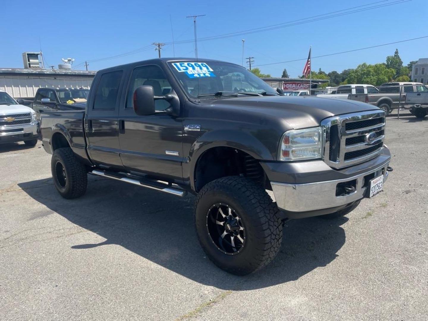 2006 Brown Ford F-250 Super Duty Lariat (1FTSW21P16E) with an 6.0L Power Stroke 6.0L Diesel Turbo V8 325hp 560ft. lbs. Direct Injection engine, 5-Speed Automatic transmission, located at 800 Riverside Ave, Roseville, CA, 95678, 916-773-4549 & Toll Free: 866-719-4393, 38.732265, -121.291039 - DIESEL CREW CAB 4X4 LARIAT LIFTED HEADSTUDS BULLET PROOF EGR COOLER SERVICE RECORDS - Photo#1
