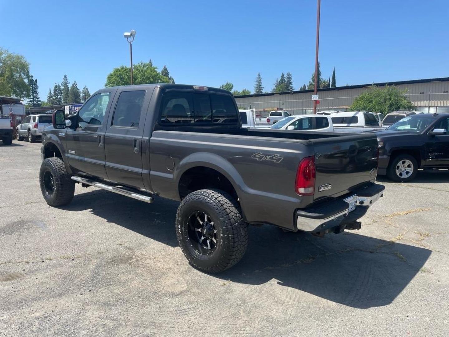 2006 Brown Ford F-250 Super Duty Lariat (1FTSW21P16E) with an 6.0L Power Stroke 6.0L Diesel Turbo V8 325hp 560ft. lbs. Direct Injection engine, 5-Speed Automatic transmission, located at 800 Riverside Ave, Roseville, CA, 95678, 916-773-4549 & Toll Free: 866-719-4393, 38.732265, -121.291039 - DIESEL CREW CAB 4X4 LARIAT LIFTED HEADSTUDS BULLET PROOF EGR COOLER SERVICE RECORDS - Photo#2