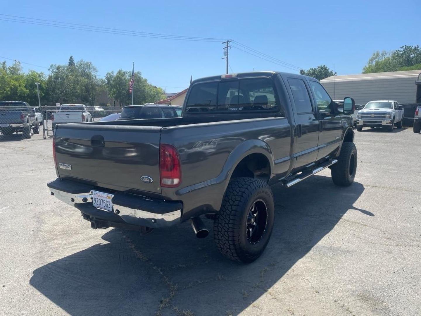 2006 Brown Ford F-250 Super Duty Lariat (1FTSW21P16E) with an 6.0L Power Stroke 6.0L Diesel Turbo V8 325hp 560ft. lbs. Direct Injection engine, 5-Speed Automatic transmission, located at 800 Riverside Ave, Roseville, CA, 95678, 916-773-4549 & Toll Free: 866-719-4393, 38.732265, -121.291039 - DIESEL CREW CAB 4X4 LARIAT LIFTED HEADSTUDS BULLET PROOF EGR COOLER SERVICE RECORDS - Photo#3