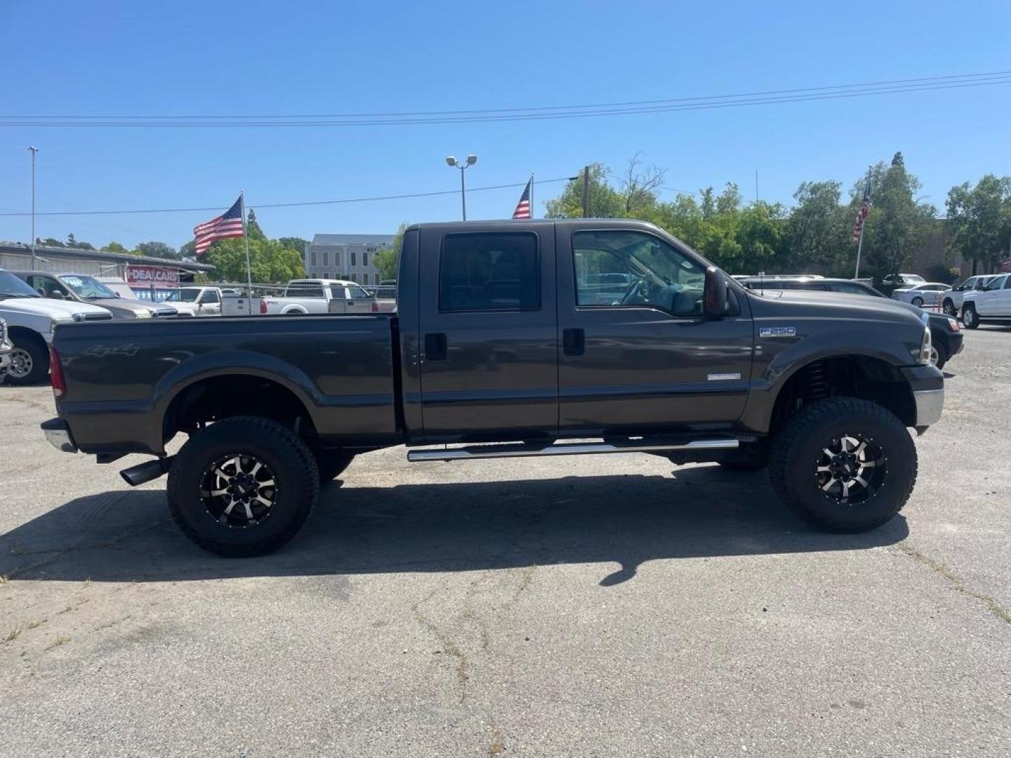 2006 Brown Ford F-250 Super Duty Lariat (1FTSW21P16E) with an 6.0L Power Stroke 6.0L Diesel Turbo V8 325hp 560ft. lbs. Direct Injection engine, 5-Speed Automatic transmission, located at 800 Riverside Ave, Roseville, CA, 95678, 916-773-4549 & Toll Free: 866-719-4393, 38.732265, -121.291039 - DIESEL CREW CAB 4X4 LARIAT LIFTED HEADSTUDS BULLET PROOF EGR COOLER SERVICE RECORDS - Photo#5