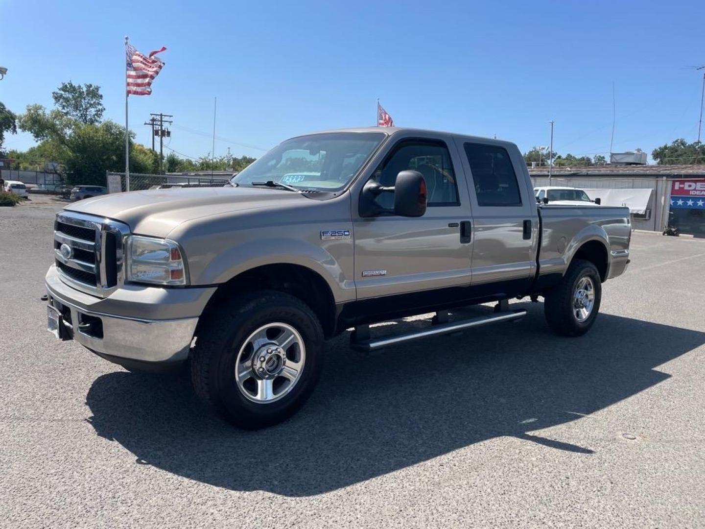 2006 Arizona Beige Clearcoat Metallic/Black Ford F-250 Super Duty Lariat (1FTSW21P36E) with an 6.0L Power Stroke 6.0L Diesel Turbo V8 325hp 560ft. lbs. Direct Injection engine, 5-Speed Automatic transmission, located at 800 Riverside Ave, Roseville, CA, 95678, 916-773-4549 & Toll Free: 866-719-4393, 38.732265, -121.291039 - DIESEL CREW CAB 4X4 LARIAT LOW MILES ONE OWNER - Photo#0