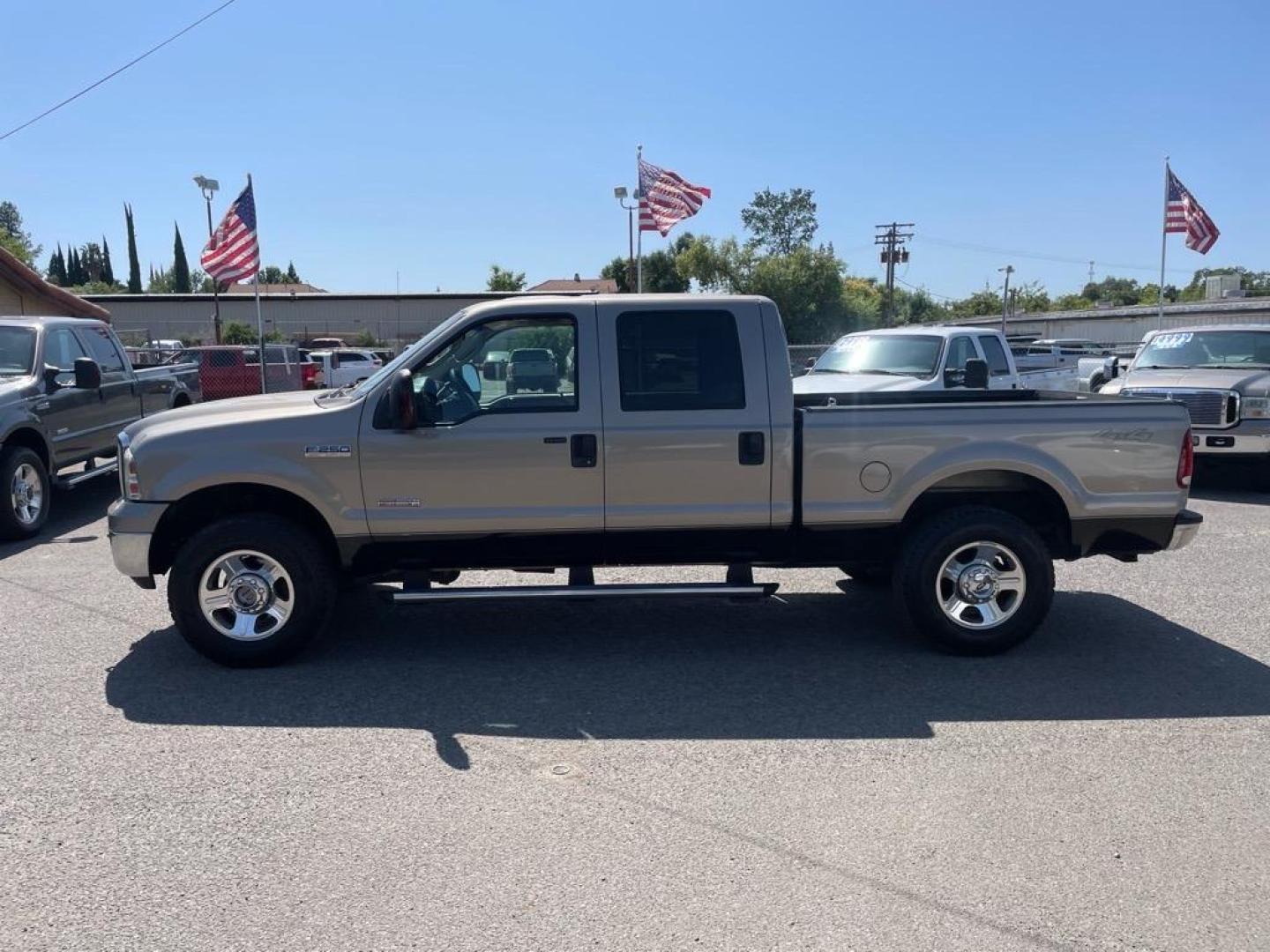 2006 Arizona Beige Clearcoat Metallic/Black Ford F-250 Super Duty Lariat (1FTSW21P36E) with an 6.0L Power Stroke 6.0L Diesel Turbo V8 325hp 560ft. lbs. Direct Injection engine, 5-Speed Automatic transmission, located at 800 Riverside Ave, Roseville, CA, 95678, 916-773-4549 & Toll Free: 866-719-4393, 38.732265, -121.291039 - DIESEL CREW CAB 4X4 LARIAT LOW MILES ONE OWNER - Photo#1