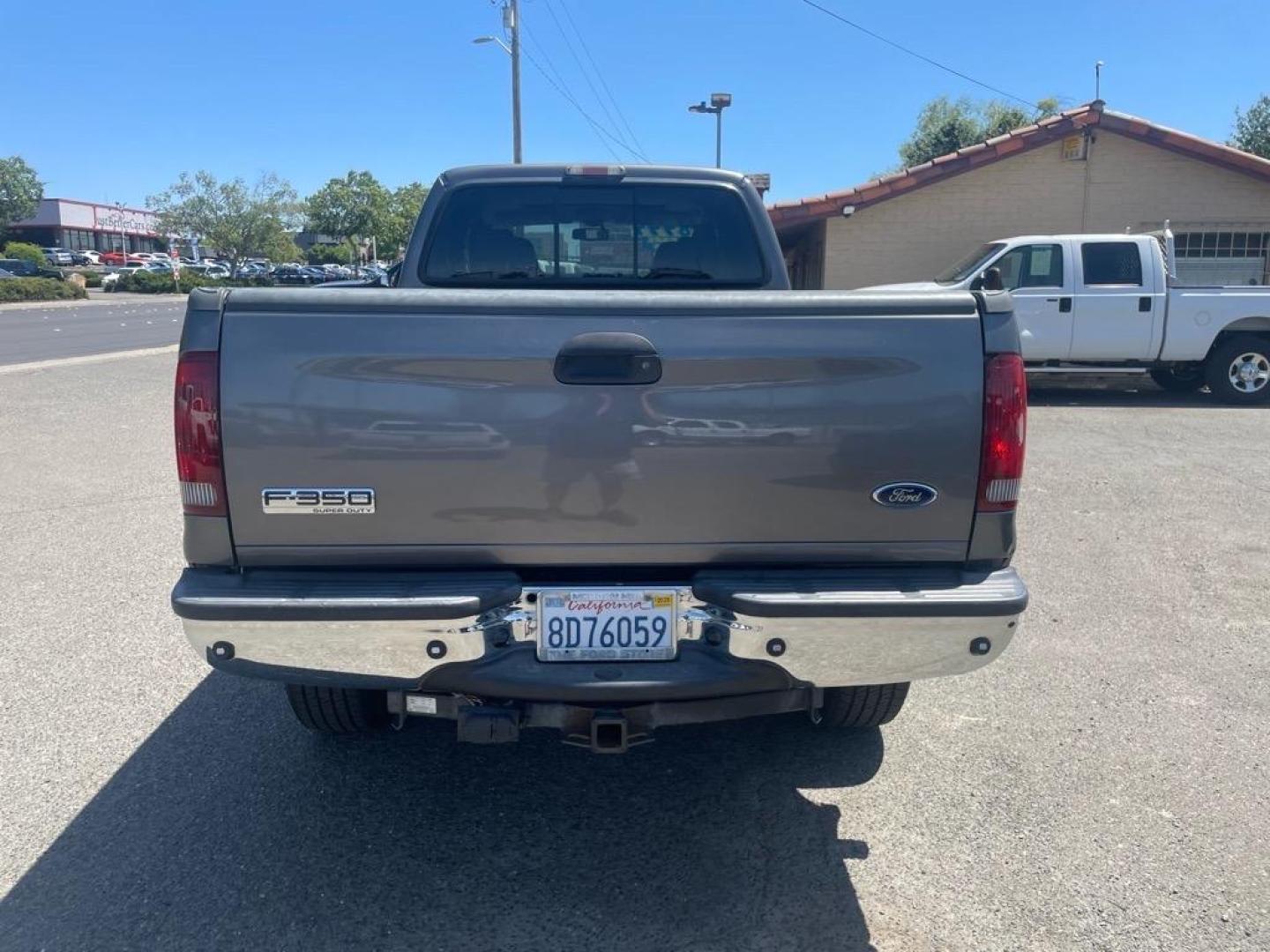 2006 Dark Shadow Grey Clearcoat Metallic Ford F-350 Super Duty Lariat (1FTWW31P26E) with an 6.0L Power Stroke 6.0L Diesel Turbo V8 325hp 560ft. lbs. Direct Injection engine, 5-Speed Automatic transmission, located at 800 Riverside Ave, Roseville, CA, 95678, 916-773-4549 & Toll Free: 866-719-4393, 38.732265, -121.291039 - DIESEL CREW CAB 4X4 LARIAT HEADSTUDS MOON ROOF - Photo#3