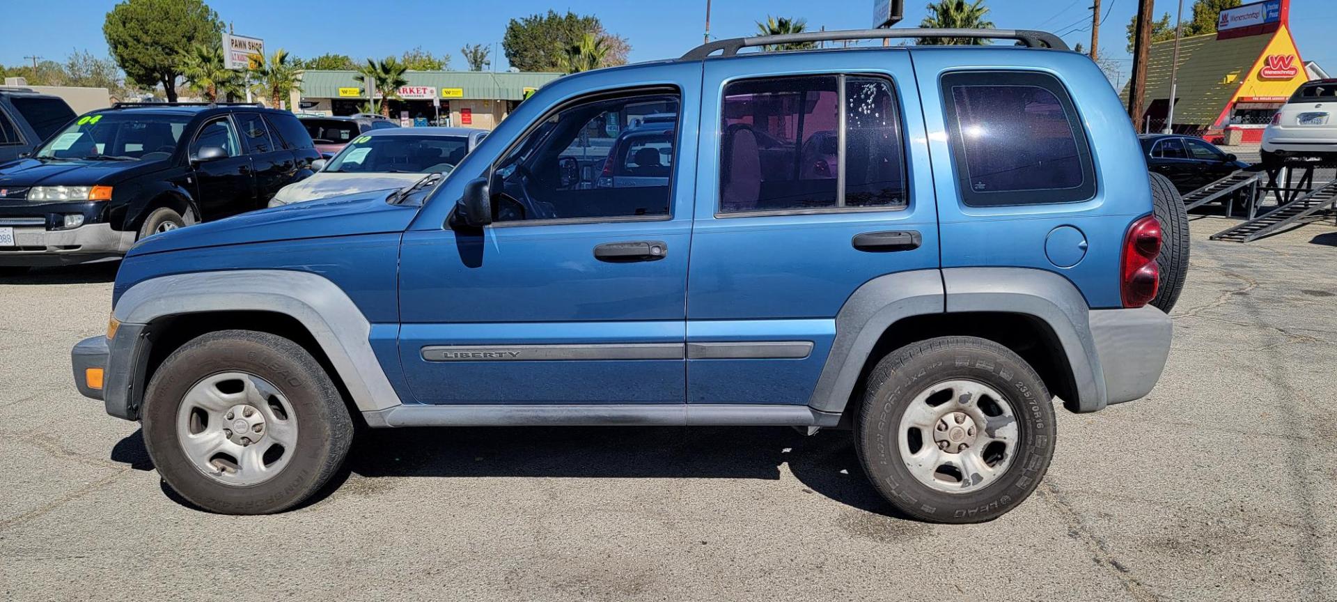 2006 Jeep Liberty Sport 2WD (1J4GK48K76W) with an 3.7L V6 SOHC 12V engine, AUTO transmission, located at 44356 Date Ave., Lancaster, CA, 93534, (661) 945-6555, 34.688919, -118.139374- Photo#2