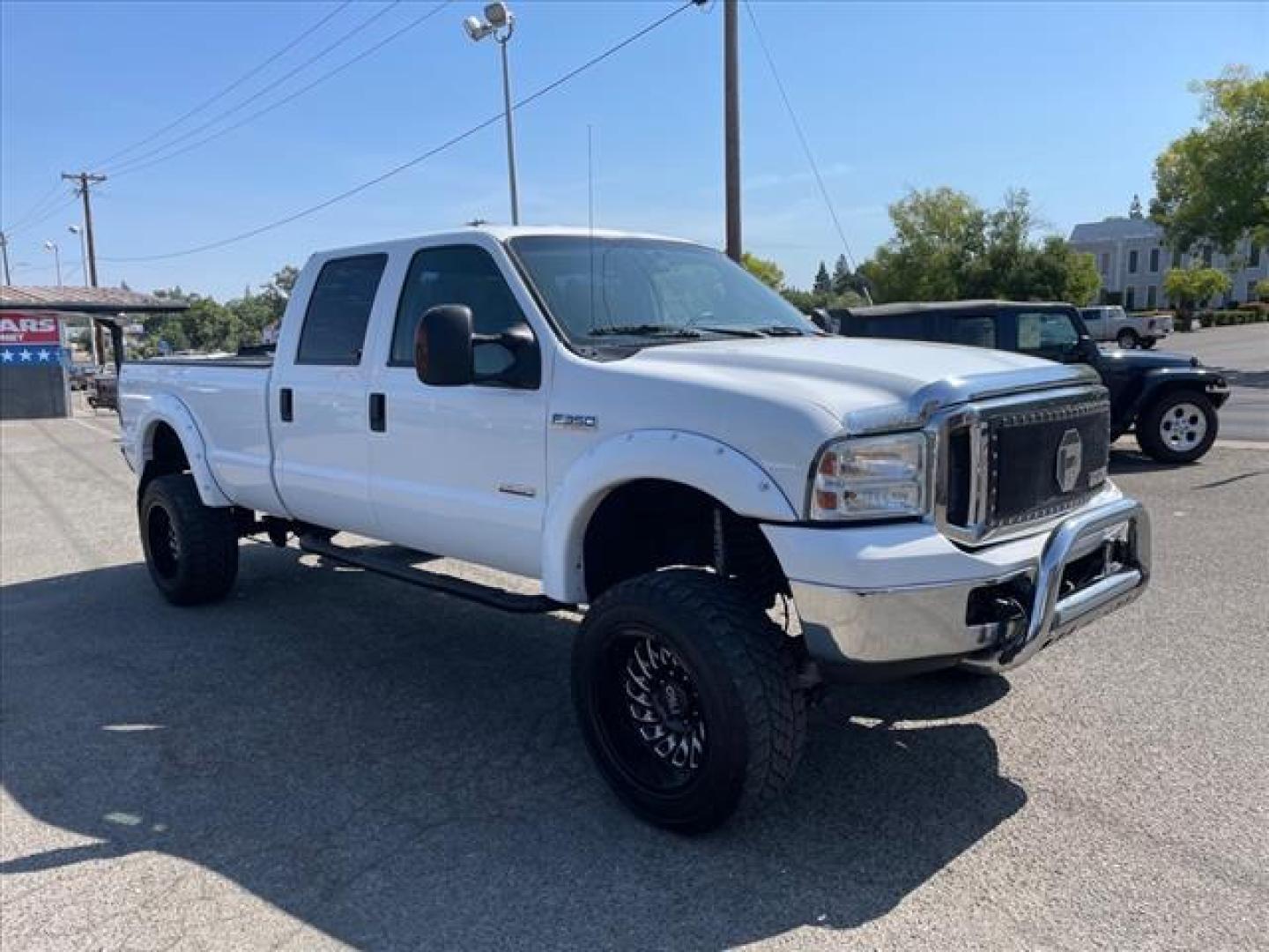 2007 Oxford White Clearcoat Ford F-350 Super Duty XLT (1FTWW31P77E) with an 6.0L 6.0L Turbo Diesel V8 OHV 32V Direct Injection engine, 5-Speed Automatic transmission, located at 800 Riverside Ave, Roseville, CA, 95678, 916-773-4549 & Toll Free: 866-719-4393, 38.732265, -121.291039 - DIESEL CREW CAB 4X4 XLT LIFTED NEW EGR COOLER AND OIL COOLER CLEAN CARFAX - Photo#1