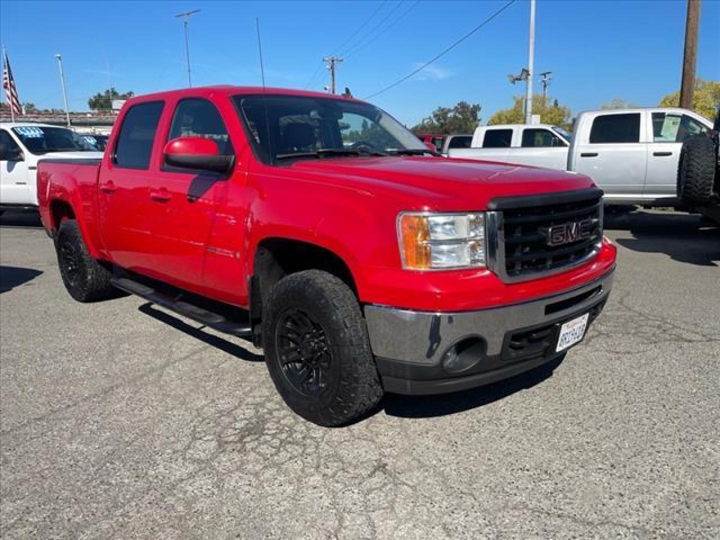 2007 Fire Red GMC Sierra 1500 SLT (2GTFK13Y871) with an 6.0L VortecMAX 6.0L V8 367hp 375ft. lbs. Other engine, 4-Speed Automatic transmission, located at 800 Riverside Ave, Roseville, CA, 95678, 916-773-4549 & Toll Free: 866-719-4393, 38.732265, -121.291039 - 4X4 CREW CAB SLT VORTEC MAX LOW MILES LEATHER DVD ONE OWNER SERVICE RECORDS - Photo#1