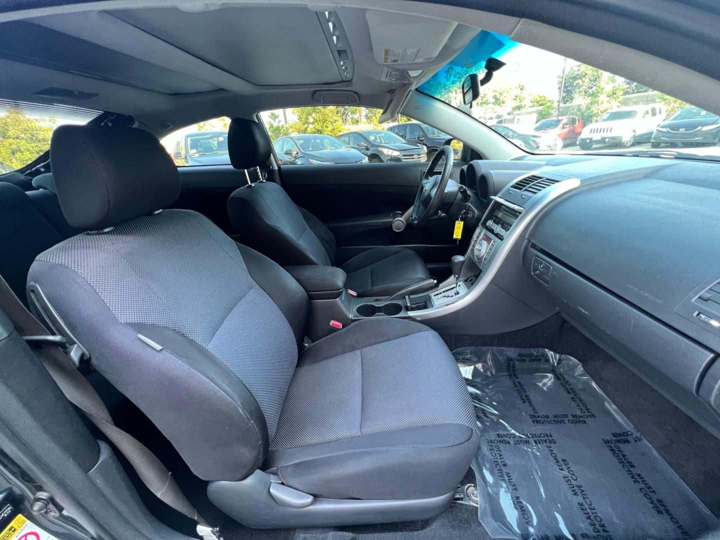 2008 Gray Metallic /Black Scion tC Sport Coupe (JTKDE167980) with an 2.4L L4 DOHC 16V engine, Automatic transmission, located at 30 S. Berkeley Avenue, Pasadena, CA, 91107, (626) 248-7567, 34.145447, -118.109398 - Discover Your Ideal Pre-Owned Vehicle at Crown City Motors in Pasadena, CA Are you in the market for a reliable used car or truck? Look no further than Crown City Motors, your trusted used car dealer located at 30 S Berkeley Ave, Pasadena, CA 91107. We take pride in offering a wide selection of h - Photo#8