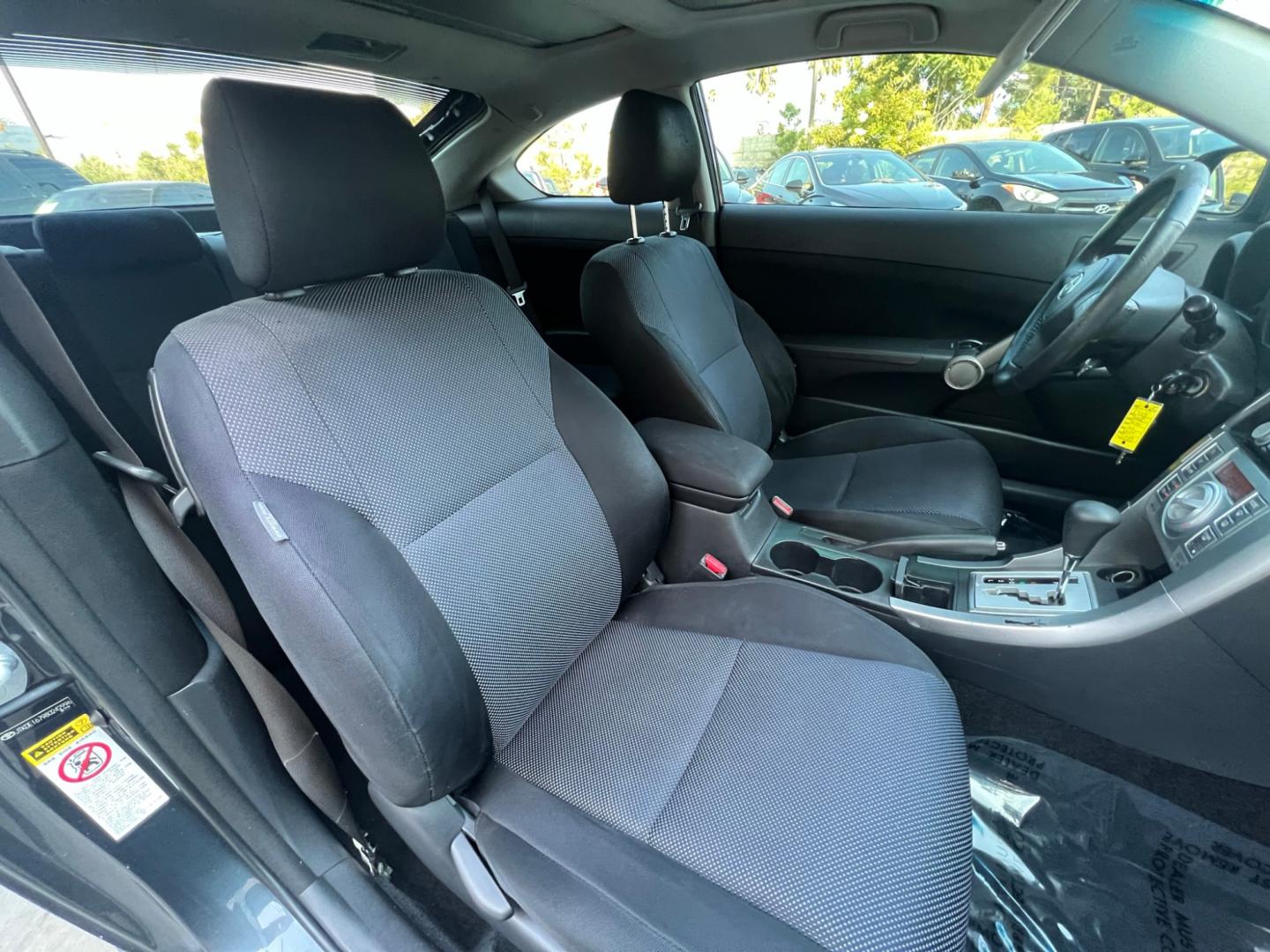 2008 Gray Metallic /Black Scion tC Sport Coupe (JTKDE167980) with an 2.4L L4 DOHC 16V engine, Automatic transmission, located at 30 S. Berkeley Avenue, Pasadena, CA, 91107, (626) 248-7567, 34.145447, -118.109398 - Discover Your Ideal Pre-Owned Vehicle at Crown City Motors in Pasadena, CA Are you in the market for a reliable used car or truck? Look no further than Crown City Motors, your trusted used car dealer located at 30 S Berkeley Ave, Pasadena, CA 91107. We take pride in offering a wide selection of h - Photo#12