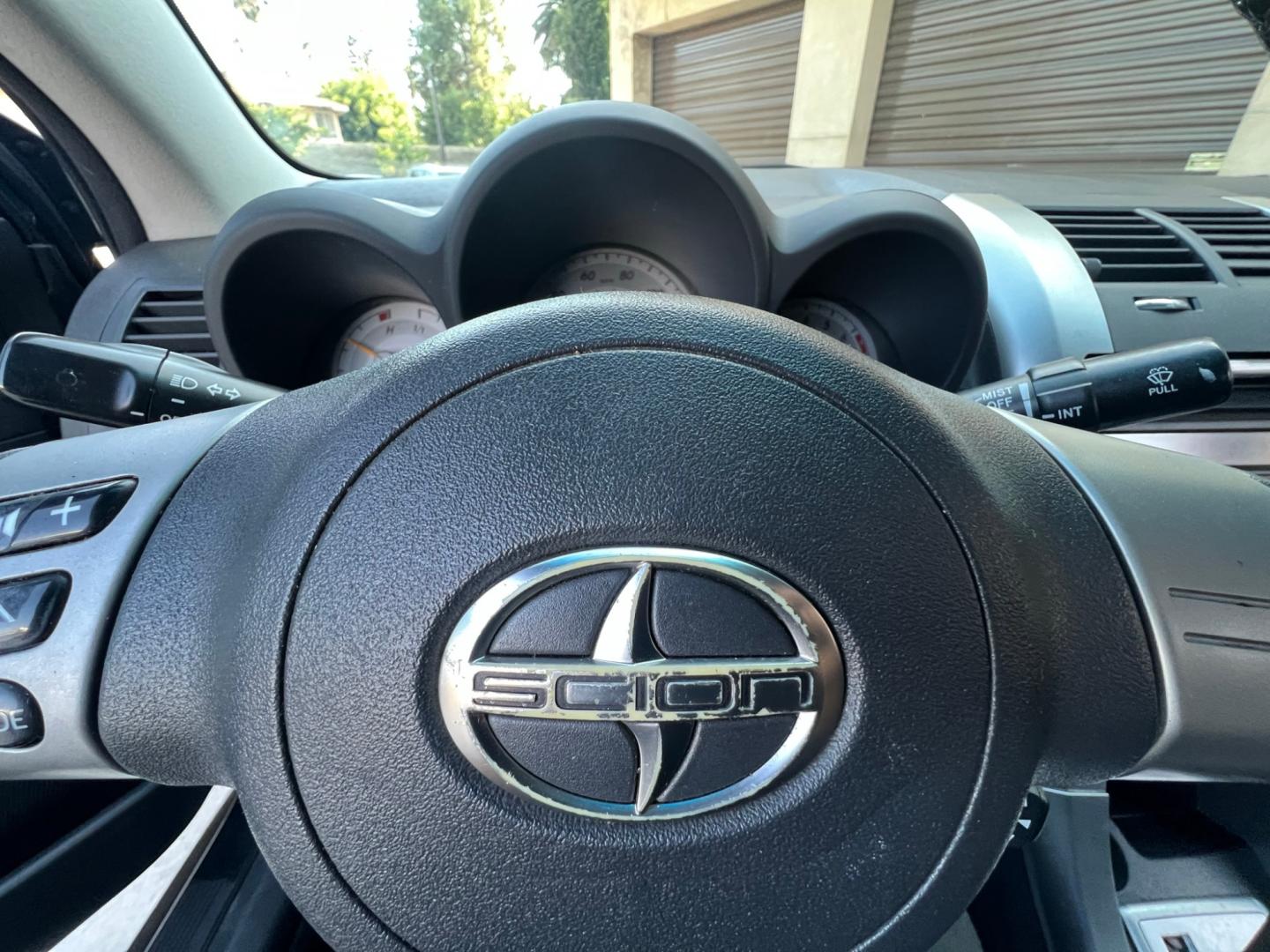 2008 Gray Metallic /Black Scion tC Sport Coupe (JTKDE167980) with an 2.4L L4 DOHC 16V engine, Automatic transmission, located at 30 S. Berkeley Avenue, Pasadena, CA, 91107, (626) 248-7567, 34.145447, -118.109398 - Discover Your Ideal Pre-Owned Vehicle at Crown City Motors in Pasadena, CA Are you in the market for a reliable used car or truck? Look no further than Crown City Motors, your trusted used car dealer located at 30 S Berkeley Ave, Pasadena, CA 91107. We take pride in offering a wide selection of h - Photo#5