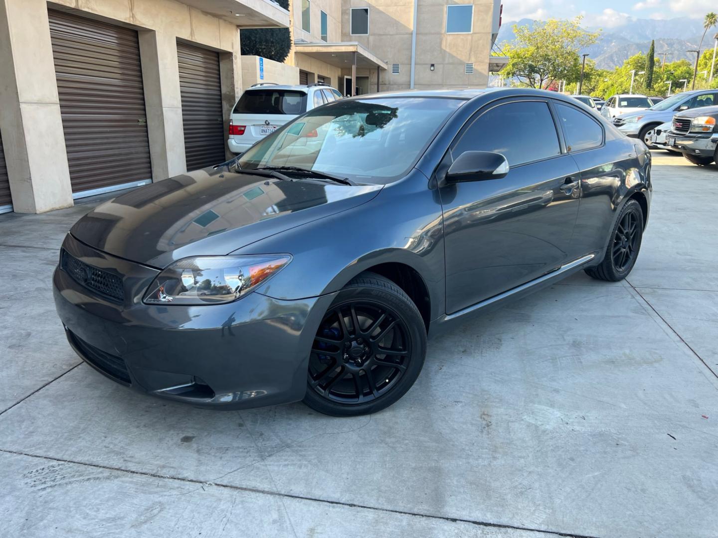 2008 Gray Metallic /Black Scion tC Sport Coupe (JTKDE167980) with an 2.4L L4 DOHC 16V engine, Automatic transmission, located at 30 S. Berkeley Avenue, Pasadena, CA, 91107, (626) 248-7567, 34.145447, -118.109398 - Discover Your Ideal Pre-Owned Vehicle at Crown City Motors in Pasadena, CA Are you in the market for a reliable used car or truck? Look no further than Crown City Motors, your trusted used car dealer located at 30 S Berkeley Ave, Pasadena, CA 91107. We take pride in offering a wide selection of h - Photo#0