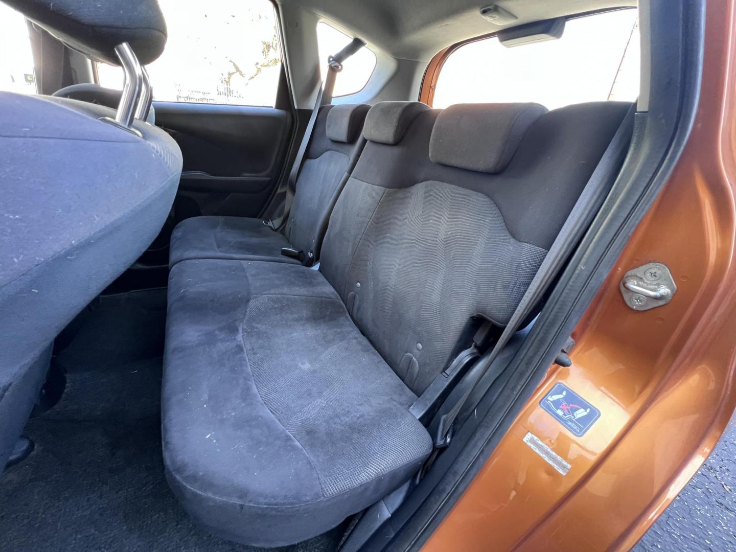 2010 Orange Revolution Metallic /Gray Honda Fit Sport 5-Speed AT (JHMGE8H48AC) with an 1.5L L4 SOHC 16V engine, 5-Speed Automatic transmission, located at 30 S. Berkeley Avenue, Pasadena, CA, 91107, (626) 248-7567, 34.145447, -118.109398 - 2010 Honda Fit for Sale at Crown City Motors - Pasadena, CA Looking for a reliable, fuel-efficient, and versatile compact car? Discover the 2010 Honda Fit, now available at Crown City Motors, located at 30 S Berkeley Ave, Pasadena, CA 91107. This vibrant subcompact hatchback, renowned for its pract - Photo#12