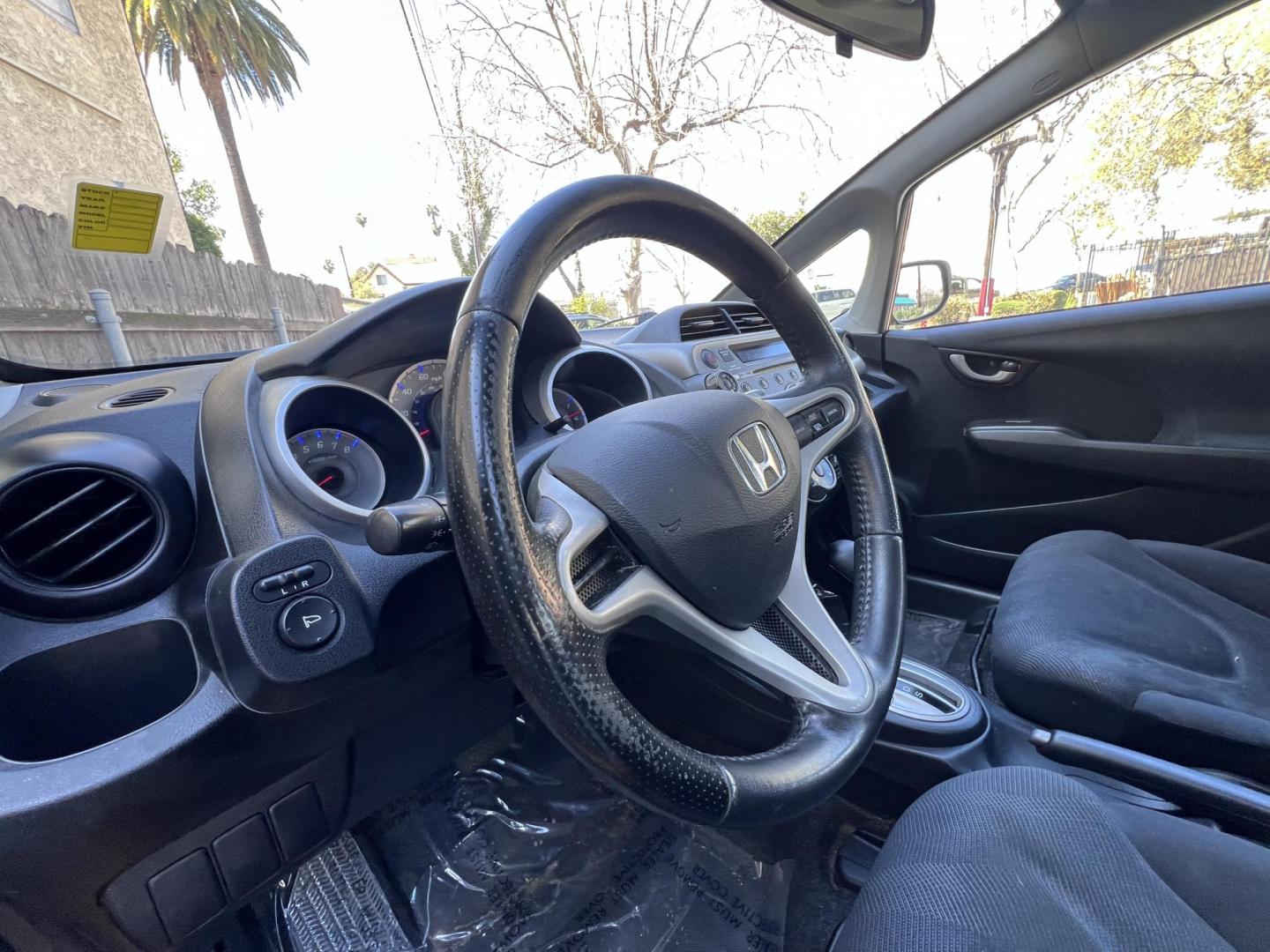 2010 Orange Revolution Metallic /Gray Honda Fit Sport 5-Speed AT (JHMGE8H48AC) with an 1.5L L4 SOHC 16V engine, 5-Speed Automatic transmission, located at 30 S. Berkeley Avenue, Pasadena, CA, 91107, (626) 248-7567, 34.145447, -118.109398 - 2010 Honda Fit for Sale at Crown City Motors - Pasadena, CA Looking for a reliable, fuel-efficient, and versatile compact car? Discover the 2010 Honda Fit, now available at Crown City Motors, located at 30 S Berkeley Ave, Pasadena, CA 91107. This vibrant subcompact hatchback, renowned for its pract - Photo#13