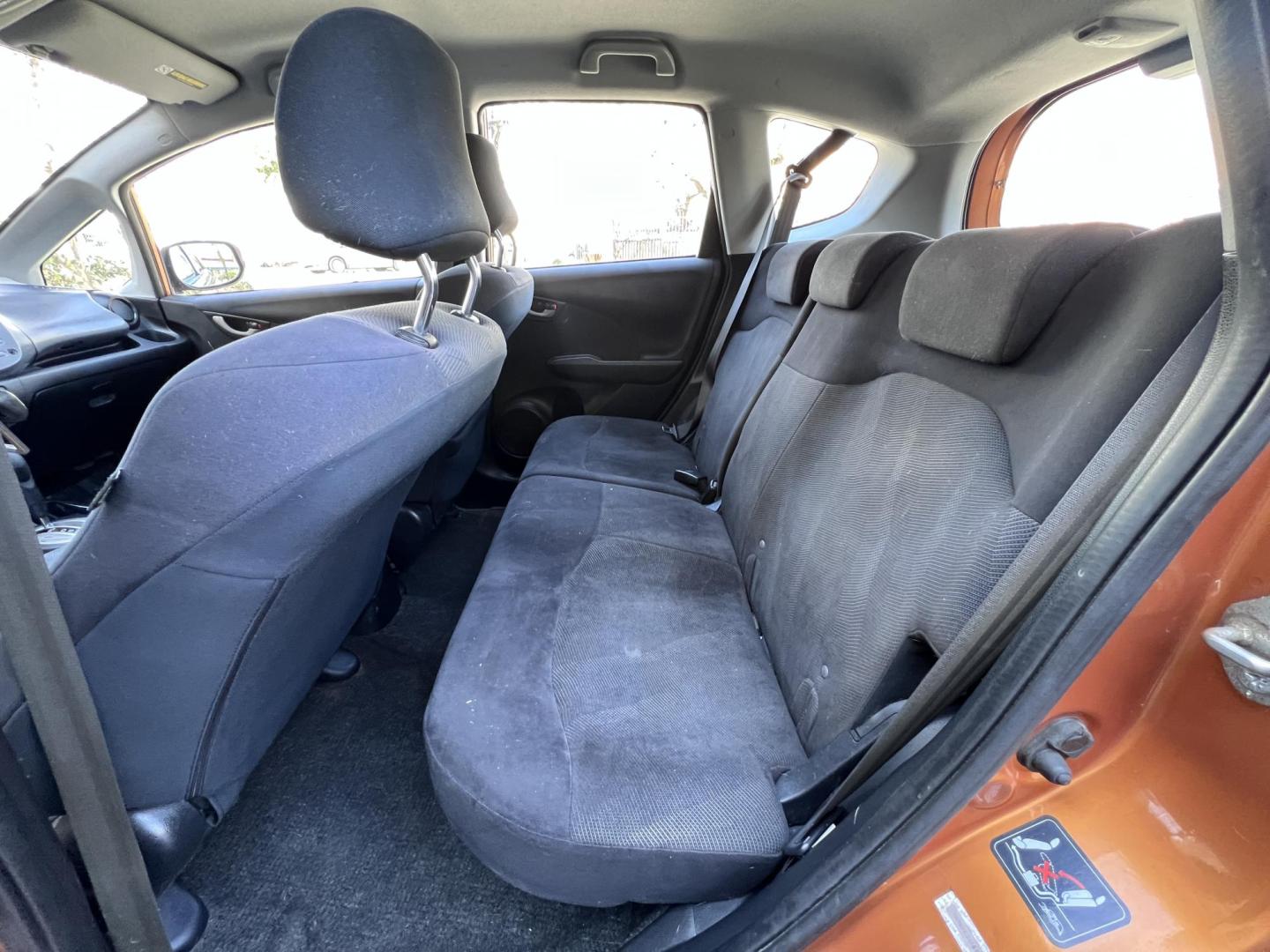 2010 Orange Revolution Metallic /Gray Honda Fit Sport 5-Speed AT (JHMGE8H48AC) with an 1.5L L4 SOHC 16V engine, 5-Speed Automatic transmission, located at 30 S. Berkeley Avenue, Pasadena, CA, 91107, (626) 248-7567, 34.145447, -118.109398 - 2010 Honda Fit for Sale at Crown City Motors - Pasadena, CA Looking for a reliable, fuel-efficient, and versatile compact car? Discover the 2010 Honda Fit, now available at Crown City Motors, located at 30 S Berkeley Ave, Pasadena, CA 91107. This vibrant subcompact hatchback, renowned for its pract - Photo#14