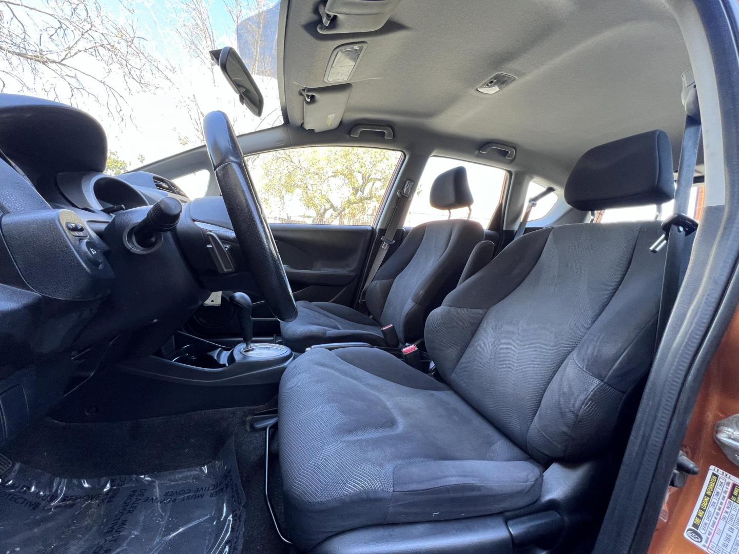 2010 Orange Revolution Metallic /Gray Honda Fit Sport 5-Speed AT (JHMGE8H48AC) with an 1.5L L4 SOHC 16V engine, 5-Speed Automatic transmission, located at 30 S. Berkeley Avenue, Pasadena, CA, 91107, (626) 248-7567, 34.145447, -118.109398 - 2010 Honda Fit for Sale at Crown City Motors - Pasadena, CA Looking for a reliable, fuel-efficient, and versatile compact car? Discover the 2010 Honda Fit, now available at Crown City Motors, located at 30 S Berkeley Ave, Pasadena, CA 91107. This vibrant subcompact hatchback, renowned for its pract - Photo#15