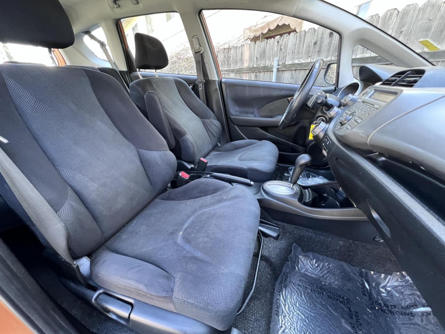 2010 Orange Revolution Metallic /Gray Honda Fit Sport 5-Speed AT (JHMGE8H48AC) with an 1.5L L4 SOHC 16V engine, 5-Speed Automatic transmission, located at 30 S. Berkeley Avenue, Pasadena, CA, 91107, (626) 248-7567, 34.145447, -118.109398 - 2010 Honda Fit for Sale at Crown City Motors - Pasadena, CA Looking for a reliable, fuel-efficient, and versatile compact car? Discover the 2010 Honda Fit, now available at Crown City Motors, located at 30 S Berkeley Ave, Pasadena, CA 91107. This vibrant subcompact hatchback, renowned for its pract - Photo#19