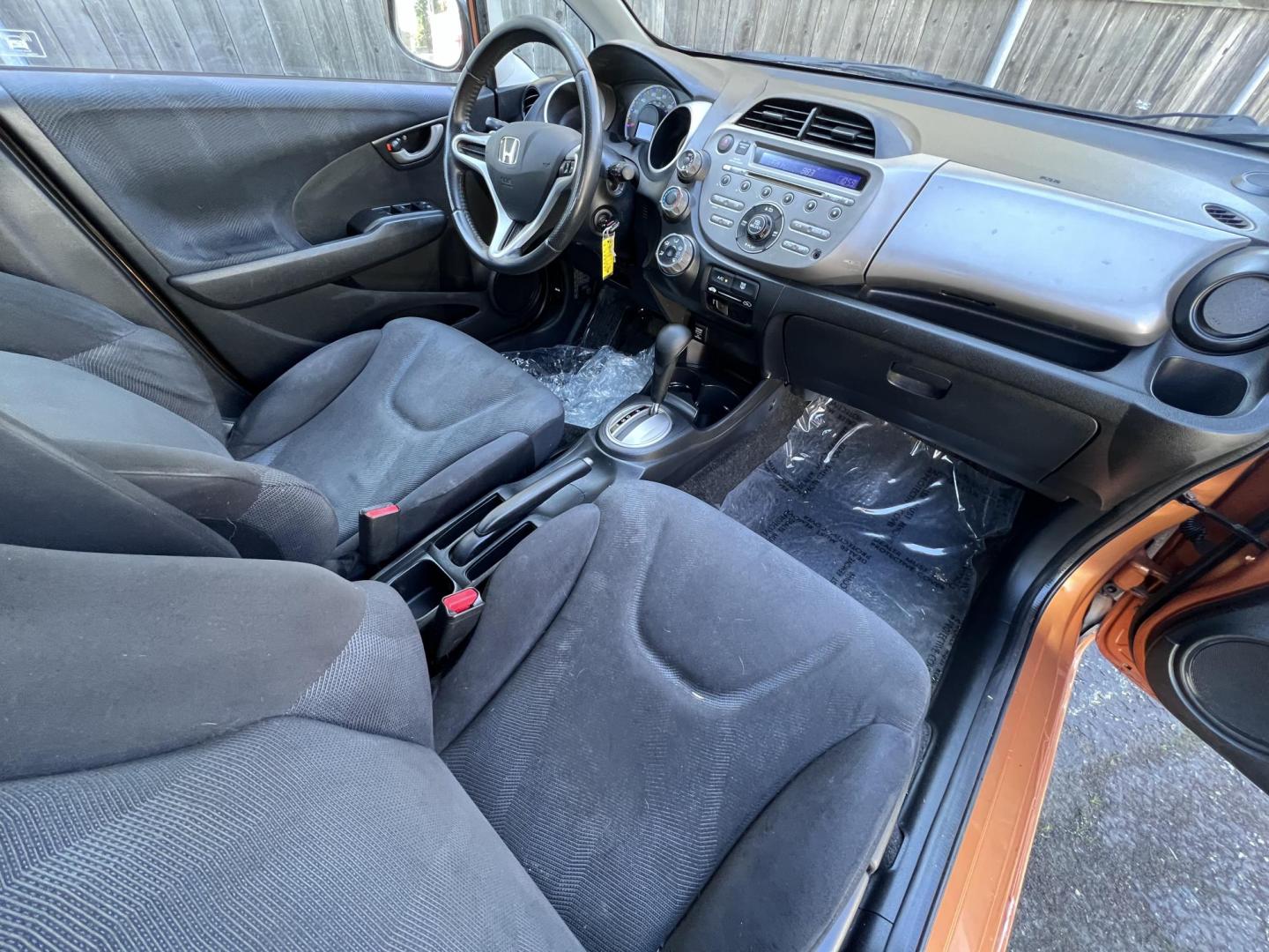 2010 Orange Revolution Metallic /Gray Honda Fit Sport 5-Speed AT (JHMGE8H48AC) with an 1.5L L4 SOHC 16V engine, 5-Speed Automatic transmission, located at 30 S. Berkeley Avenue, Pasadena, CA, 91107, (626) 248-7567, 34.145447, -118.109398 - 2010 Honda Fit for Sale at Crown City Motors - Pasadena, CA Looking for a reliable, fuel-efficient, and versatile compact car? Discover the 2010 Honda Fit, now available at Crown City Motors, located at 30 S Berkeley Ave, Pasadena, CA 91107. This vibrant subcompact hatchback, renowned for its pract - Photo#20
