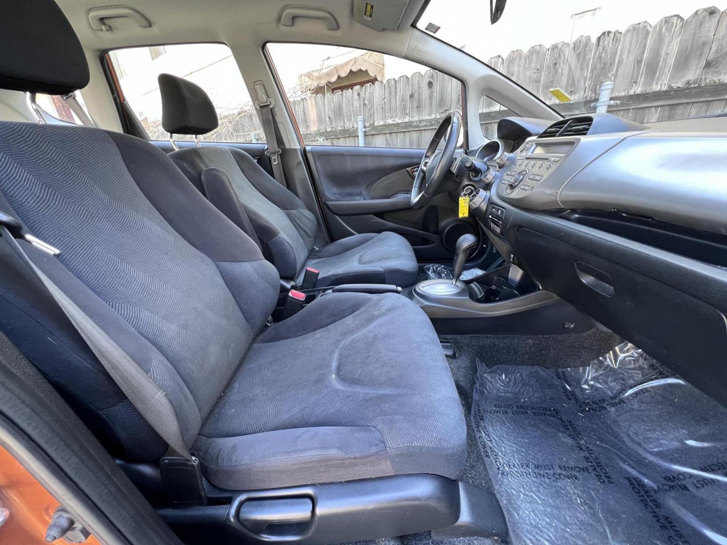 2010 Orange Revolution Metallic /Gray Honda Fit Sport 5-Speed AT (JHMGE8H48AC) with an 1.5L L4 SOHC 16V engine, 5-Speed Automatic transmission, located at 30 S. Berkeley Avenue, Pasadena, CA, 91107, (626) 248-7567, 34.145447, -118.109398 - 2010 Honda Fit for Sale at Crown City Motors - Pasadena, CA Looking for a reliable, fuel-efficient, and versatile compact car? Discover the 2010 Honda Fit, now available at Crown City Motors, located at 30 S Berkeley Ave, Pasadena, CA 91107. This vibrant subcompact hatchback, renowned for its pract - Photo#21