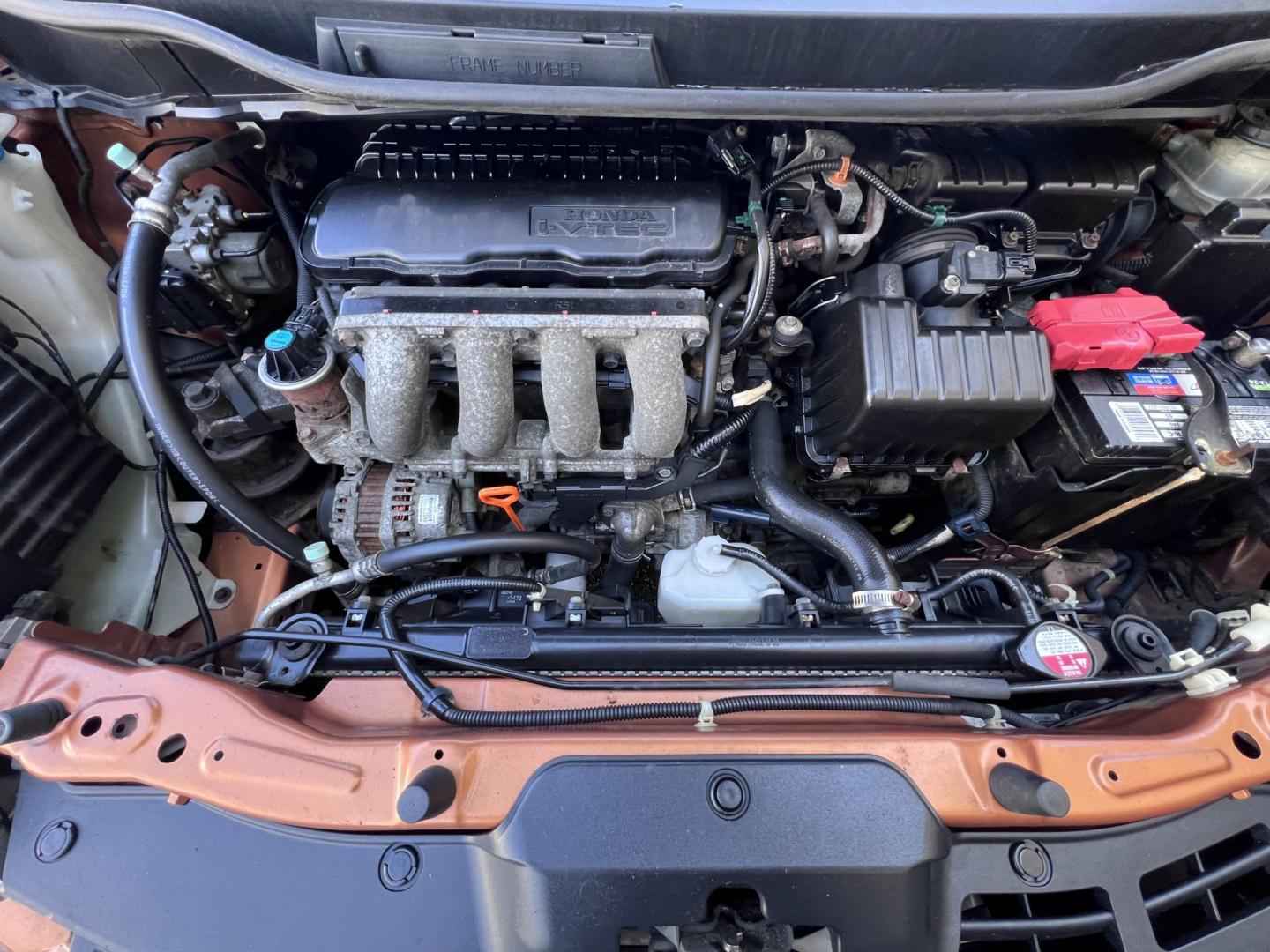 2010 Orange Revolution Metallic /Gray Honda Fit Sport 5-Speed AT (JHMGE8H48AC) with an 1.5L L4 SOHC 16V engine, 5-Speed Automatic transmission, located at 30 S. Berkeley Avenue, Pasadena, CA, 91107, (626) 248-7567, 34.145447, -118.109398 - 2010 Honda Fit for Sale at Crown City Motors - Pasadena, CA Looking for a reliable, fuel-efficient, and versatile compact car? Discover the 2010 Honda Fit, now available at Crown City Motors, located at 30 S Berkeley Ave, Pasadena, CA 91107. This vibrant subcompact hatchback, renowned for its pract - Photo#30