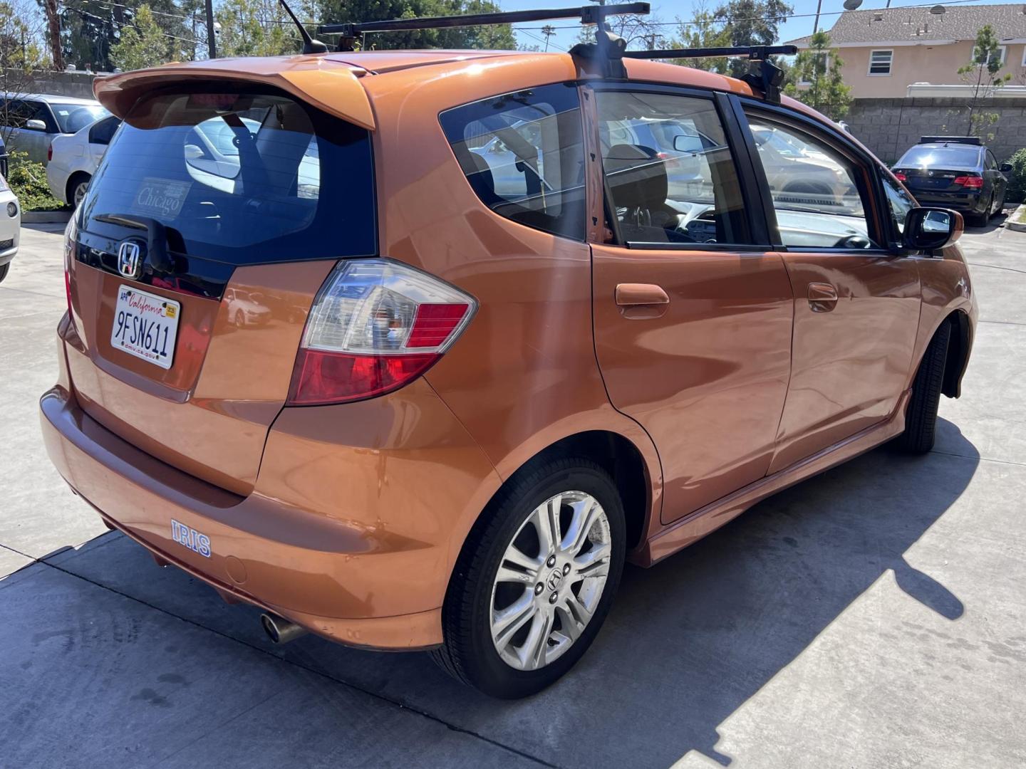 2010 Orange Revolution Metallic /Gray Honda Fit Sport 5-Speed AT (JHMGE8H48AC) with an 1.5L L4 SOHC 16V engine, 5-Speed Automatic transmission, located at 30 S. Berkeley Avenue, Pasadena, CA, 91107, (626) 248-7567, 34.145447, -118.109398 - 2010 Honda Fit for Sale at Crown City Motors - Pasadena, CA Looking for a reliable, fuel-efficient, and versatile compact car? Discover the 2010 Honda Fit, now available at Crown City Motors, located at 30 S Berkeley Ave, Pasadena, CA 91107. This vibrant subcompact hatchback, renowned for its pract - Photo#4