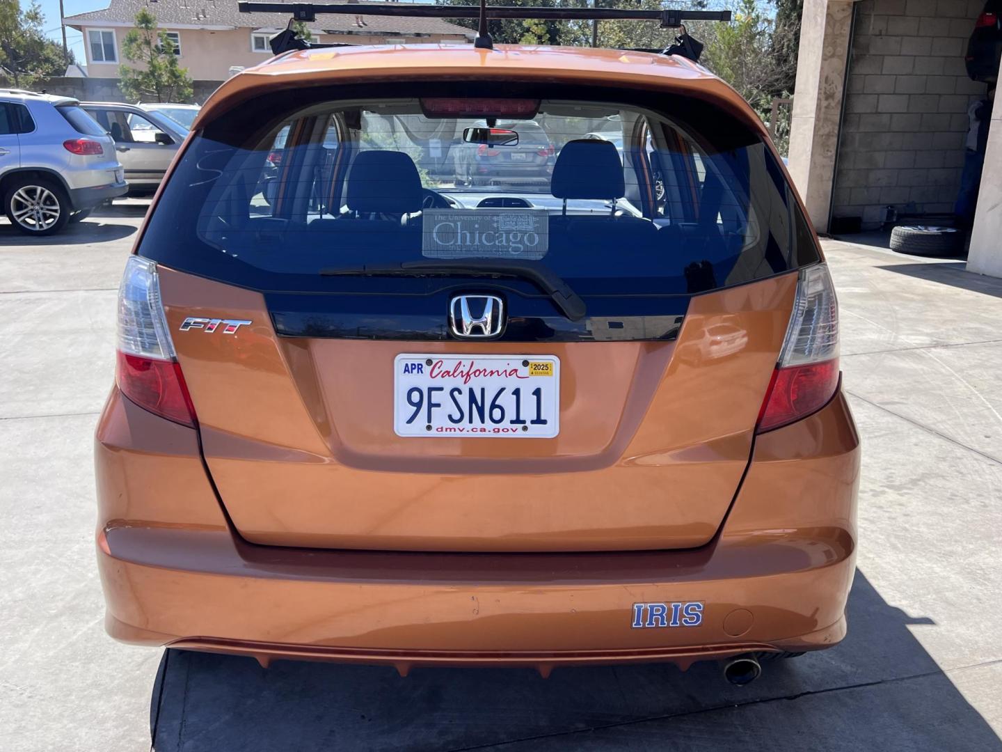 2010 Orange Revolution Metallic /Gray Honda Fit Sport 5-Speed AT (JHMGE8H48AC) with an 1.5L L4 SOHC 16V engine, 5-Speed Automatic transmission, located at 30 S. Berkeley Avenue, Pasadena, CA, 91107, (626) 248-7567, 34.145447, -118.109398 - 2010 Honda Fit for Sale at Crown City Motors - Pasadena, CA Looking for a reliable, fuel-efficient, and versatile compact car? Discover the 2010 Honda Fit, now available at Crown City Motors, located at 30 S Berkeley Ave, Pasadena, CA 91107. This vibrant subcompact hatchback, renowned for its pract - Photo#5