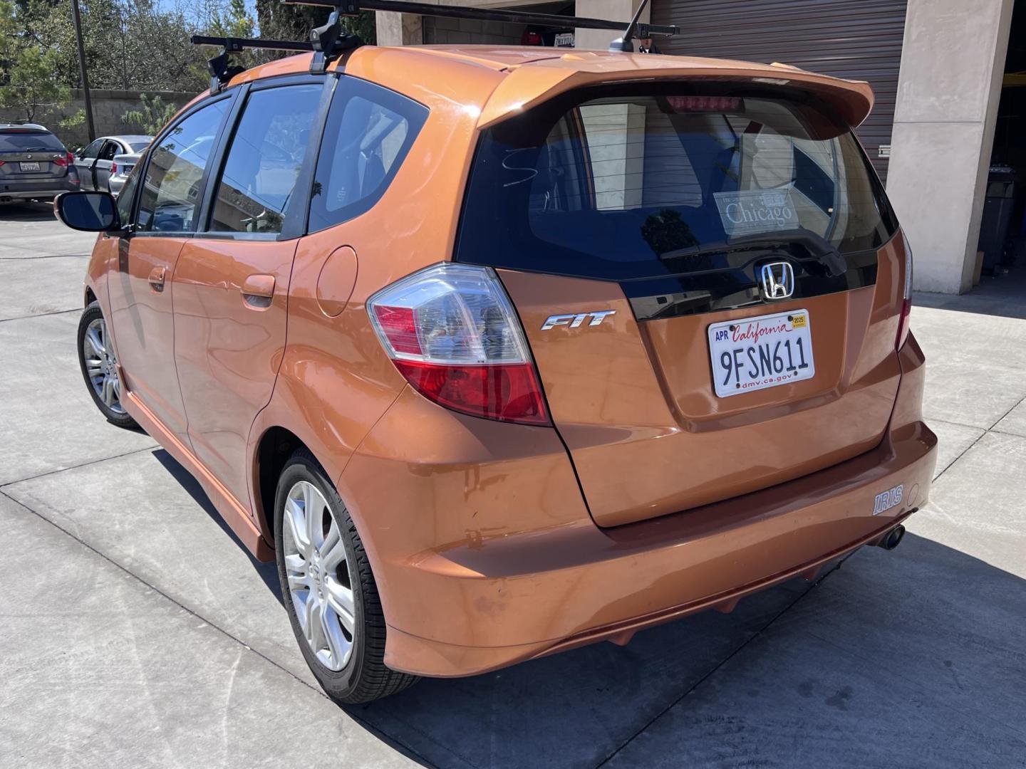 2010 Orange Revolution Metallic /Gray Honda Fit Sport 5-Speed AT (JHMGE8H48AC) with an 1.5L L4 SOHC 16V engine, 5-Speed Automatic transmission, located at 30 S. Berkeley Avenue, Pasadena, CA, 91107, (626) 248-7567, 34.145447, -118.109398 - 2010 Honda Fit for Sale at Crown City Motors - Pasadena, CA Looking for a reliable, fuel-efficient, and versatile compact car? Discover the 2010 Honda Fit, now available at Crown City Motors, located at 30 S Berkeley Ave, Pasadena, CA 91107. This vibrant subcompact hatchback, renowned for its pract - Photo#6