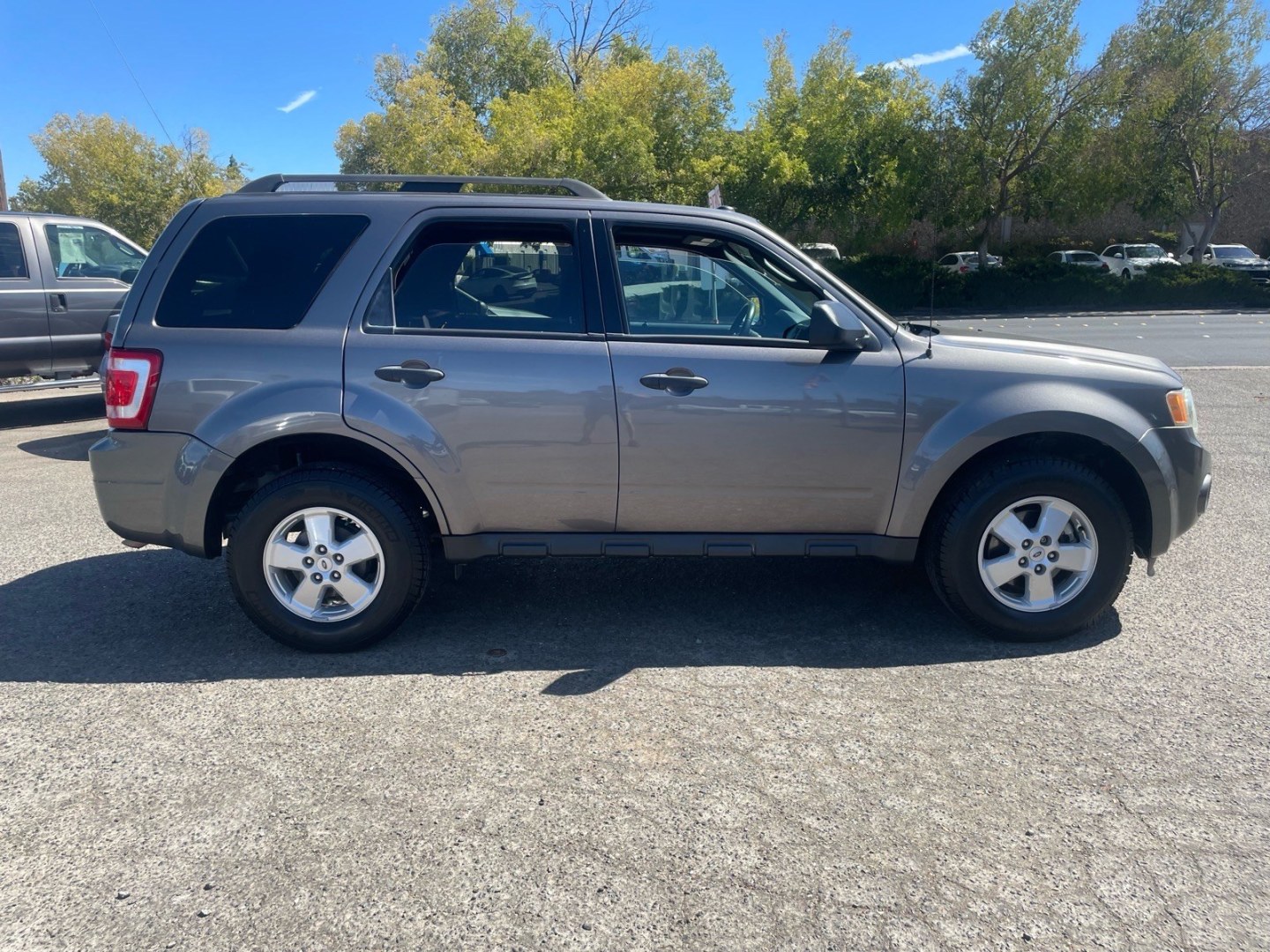 2010 Sterling Grey Metallic Ford Escape XLT (1FMCU0D74AK) with an 2.5L Duratec 2.5L I4 171hp 171ft. lbs. Sequential Multiport Fuel Injection engine, 6-Speed Automatic transmission, located at 800 Riverside Ave, Roseville, CA, 95678, 916-773-4549 & Toll Free: 866-719-4393, 38.732265, -121.291039 - XLT SERVICE RECORDS- Photo#5