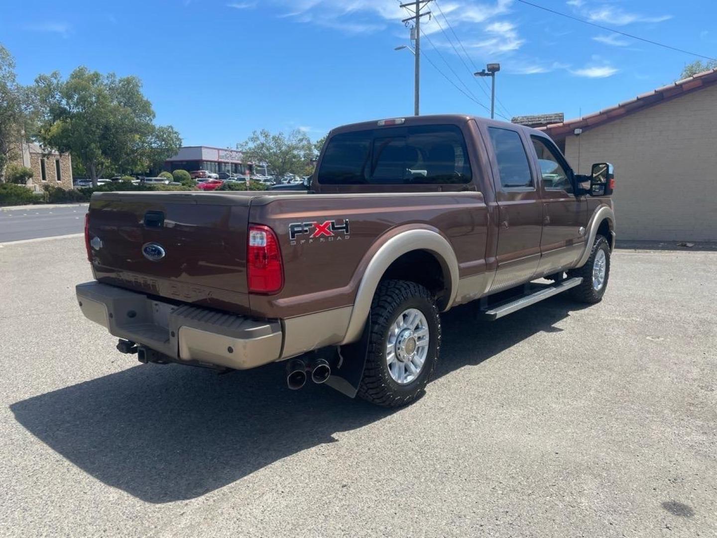 2011 Golden Bronze Metallic/Pale Adobe Metallic Ford F-250 Super Duty King Ranch (1FT7W2BTXBE) with an 6.7L Power Stroke 6.7L Biodiesel Turbo V8 400hp 800ft. lbs. Common Rail Direct Injection engine, 6-Speed Shiftable Automatic transmission, located at 800 Riverside Ave, Roseville, CA, 95678, 916-773-4549 & Toll Free: 866-719-4393, 38.732265, -121.291039 - DIESEL CREW CAB 4X4 FX4 KING RANCH SERVICE RECORDS ON CLEAN CARFAX - Photo#3