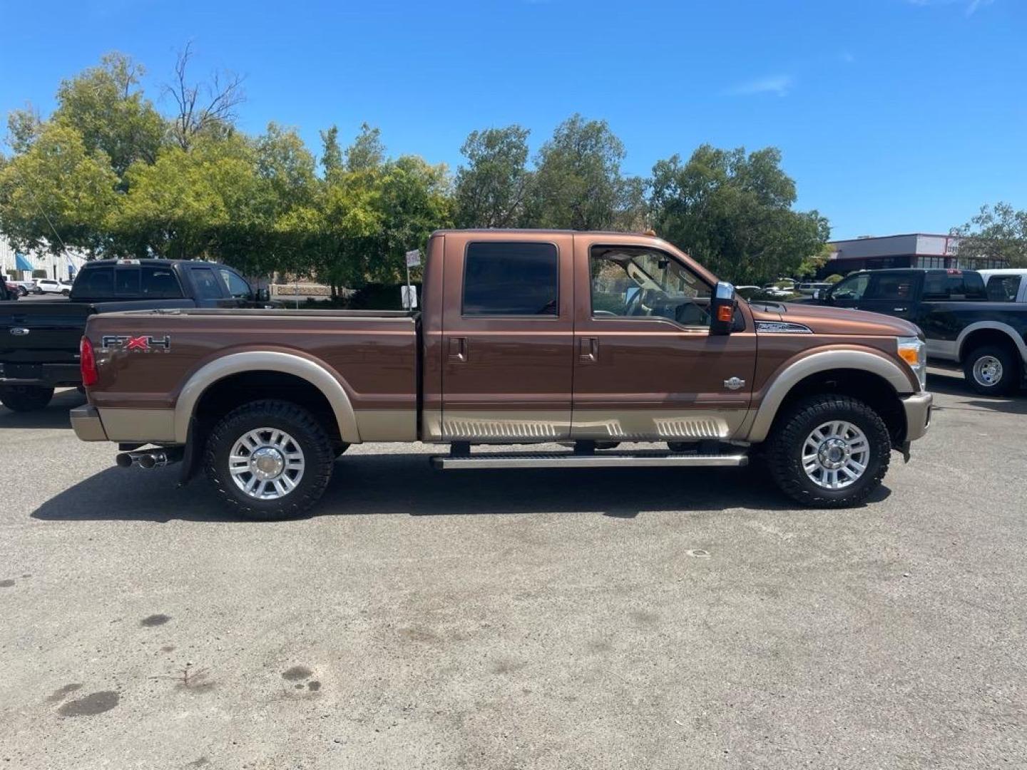 2011 Golden Bronze Metallic/Pale Adobe Metallic Ford F-250 Super Duty King Ranch (1FT7W2BTXBE) with an 6.7L Power Stroke 6.7L Biodiesel Turbo V8 400hp 800ft. lbs. Common Rail Direct Injection engine, 6-Speed Shiftable Automatic transmission, located at 800 Riverside Ave, Roseville, CA, 95678, 916-773-4549 & Toll Free: 866-719-4393, 38.732265, -121.291039 - DIESEL CREW CAB 4X4 FX4 KING RANCH SERVICE RECORDS ON CLEAN CARFAX - Photo#5