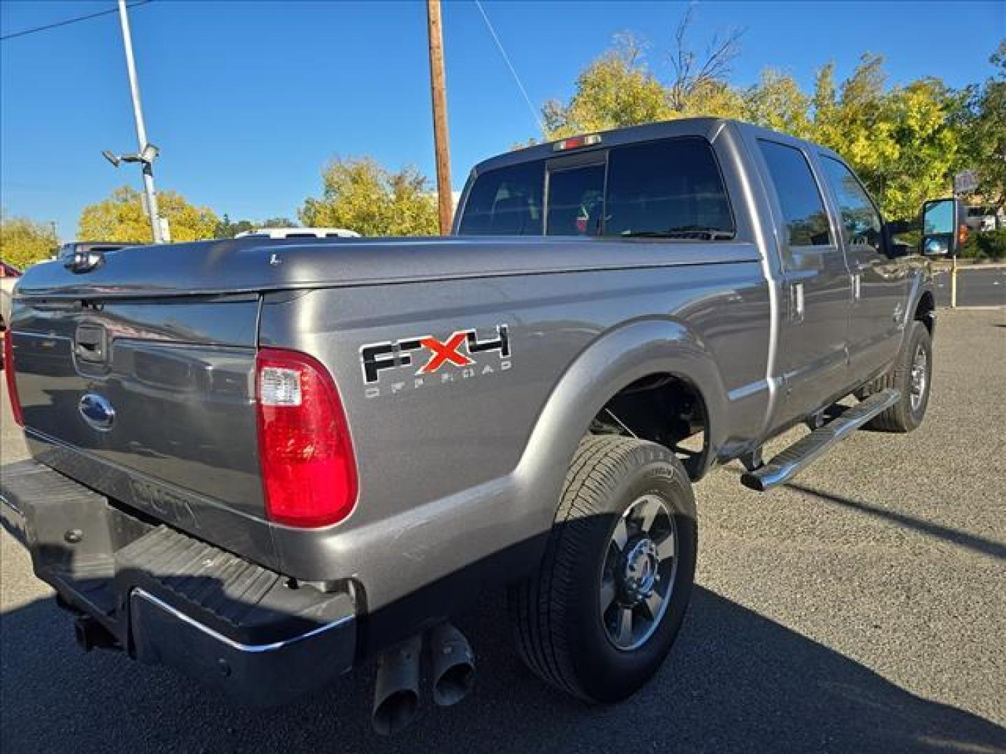 2011 Sterling Grey Metallic Ford F-250 Super Duty Lariat (1FT7W29F1BE) with an 6.7L Power Stroke 6.7L Biodiesel Turbo V8 400hp 800ft. lbs. Common Rail Direct Injection engine, 6-Speed Shiftable Automatic transmission, located at 800 Riverside Ave, Roseville, CA, 95678, 916-773-4549 & Toll Free: 866-719-4393, 38.732265, -121.291039 - DIESEL CREW CAB 4X4 FX4 LOW MILES 1 OWNER - Photo#4